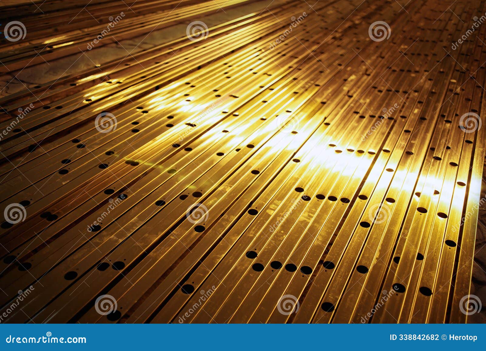 an array of metal pipes arranged in a radial pattern.