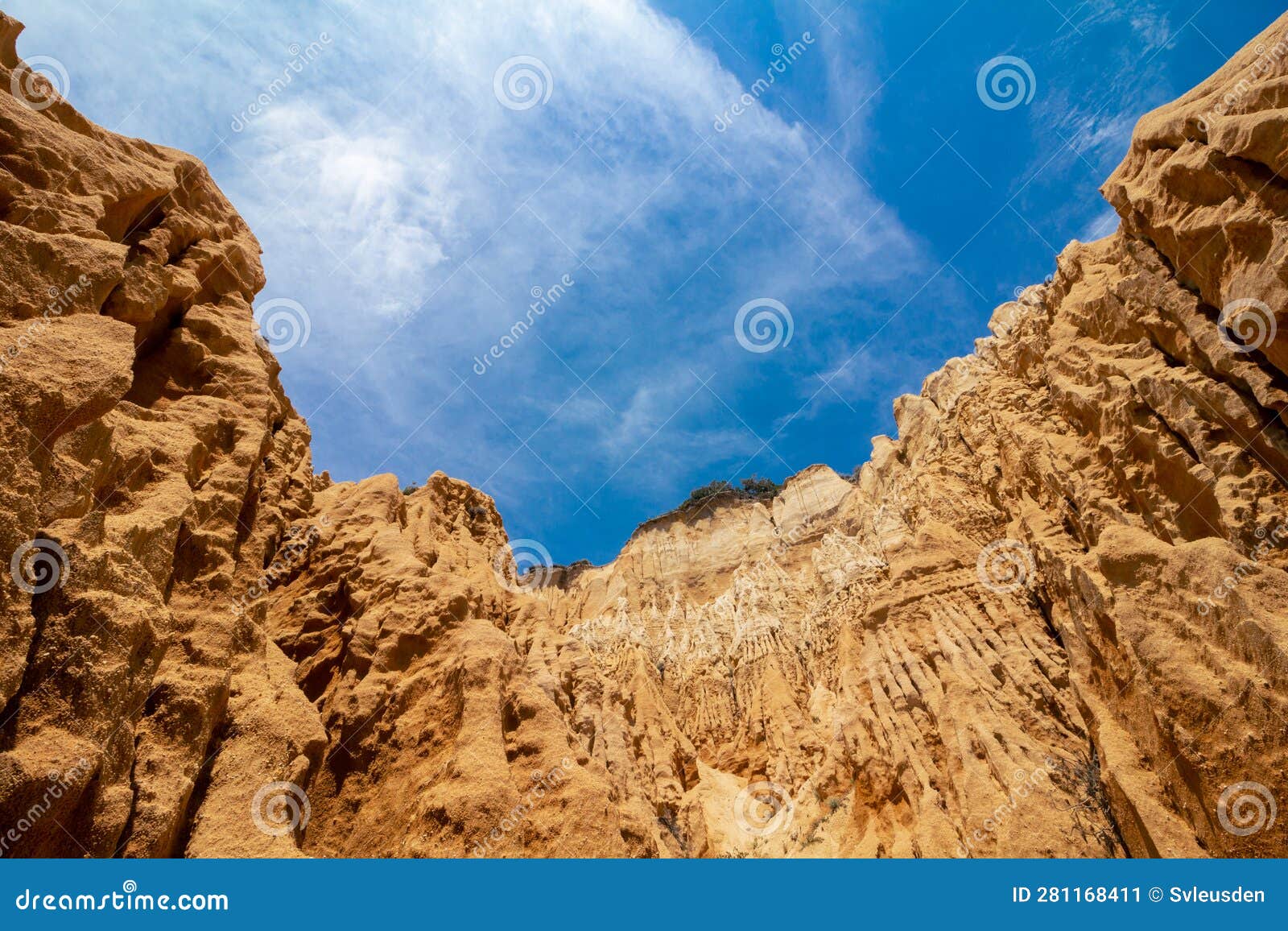 arriba fÃ³ssil da galÃ©, erosion caused by rainfall on the rocks of a cliff on a beach in setubÃ¡l