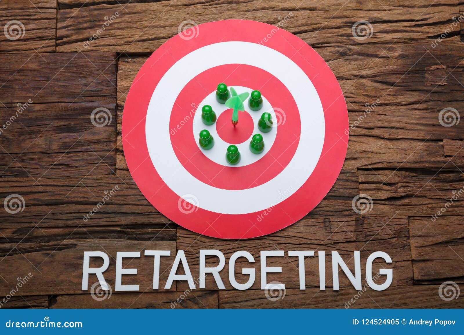arrow and pawn figurines on dartboard with retargeting text