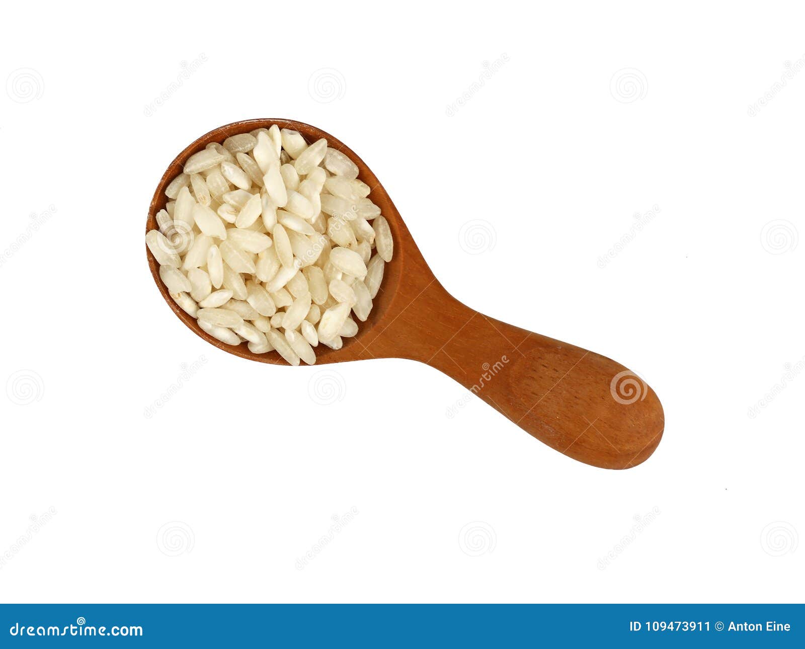 Arroz Blanco De Arborio En Cucharada De Madera En Blanco Imagen de