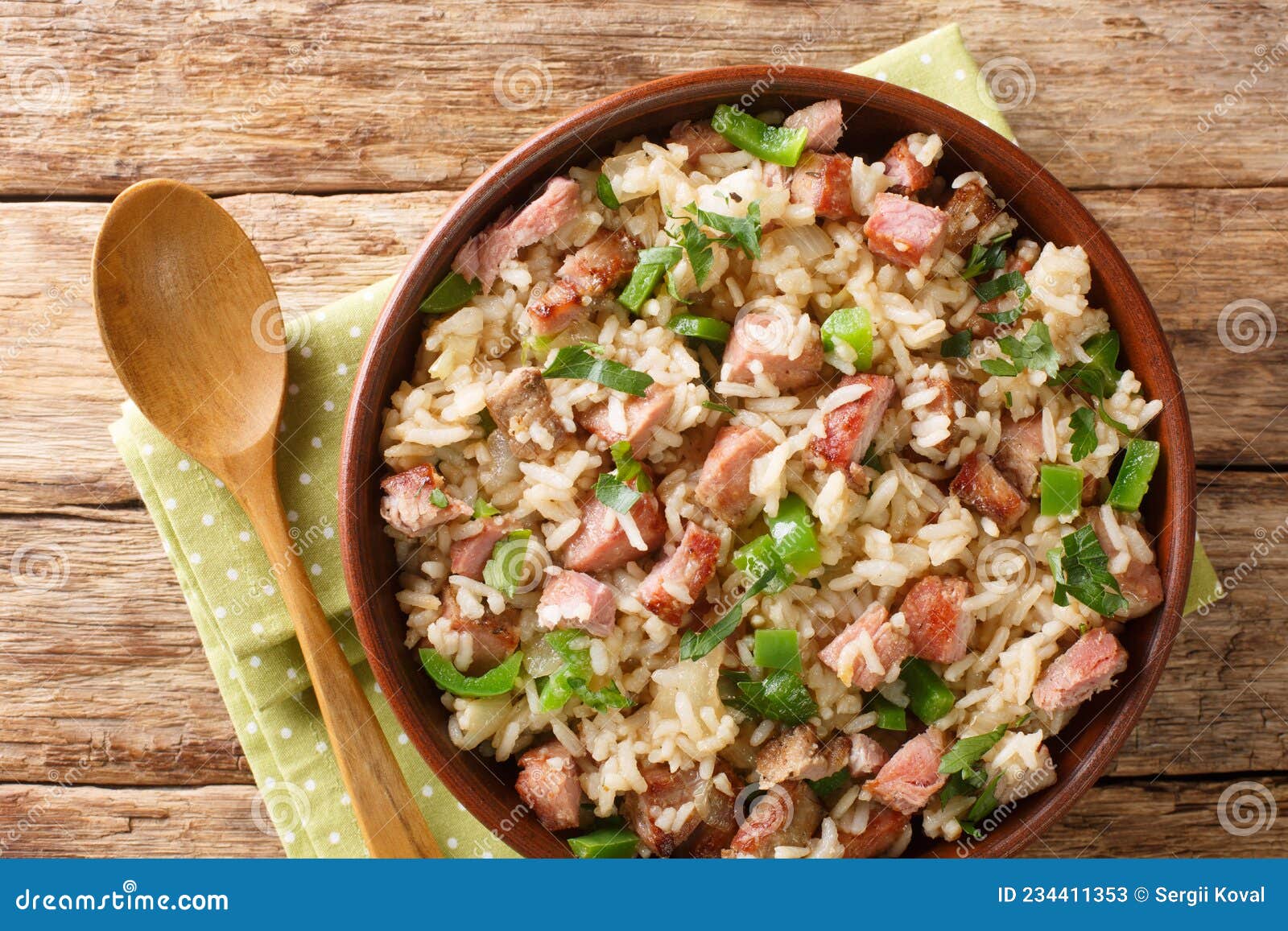 arroz carreteiro is a hearty rice and meat dish close up in the bowl. horizontal top view