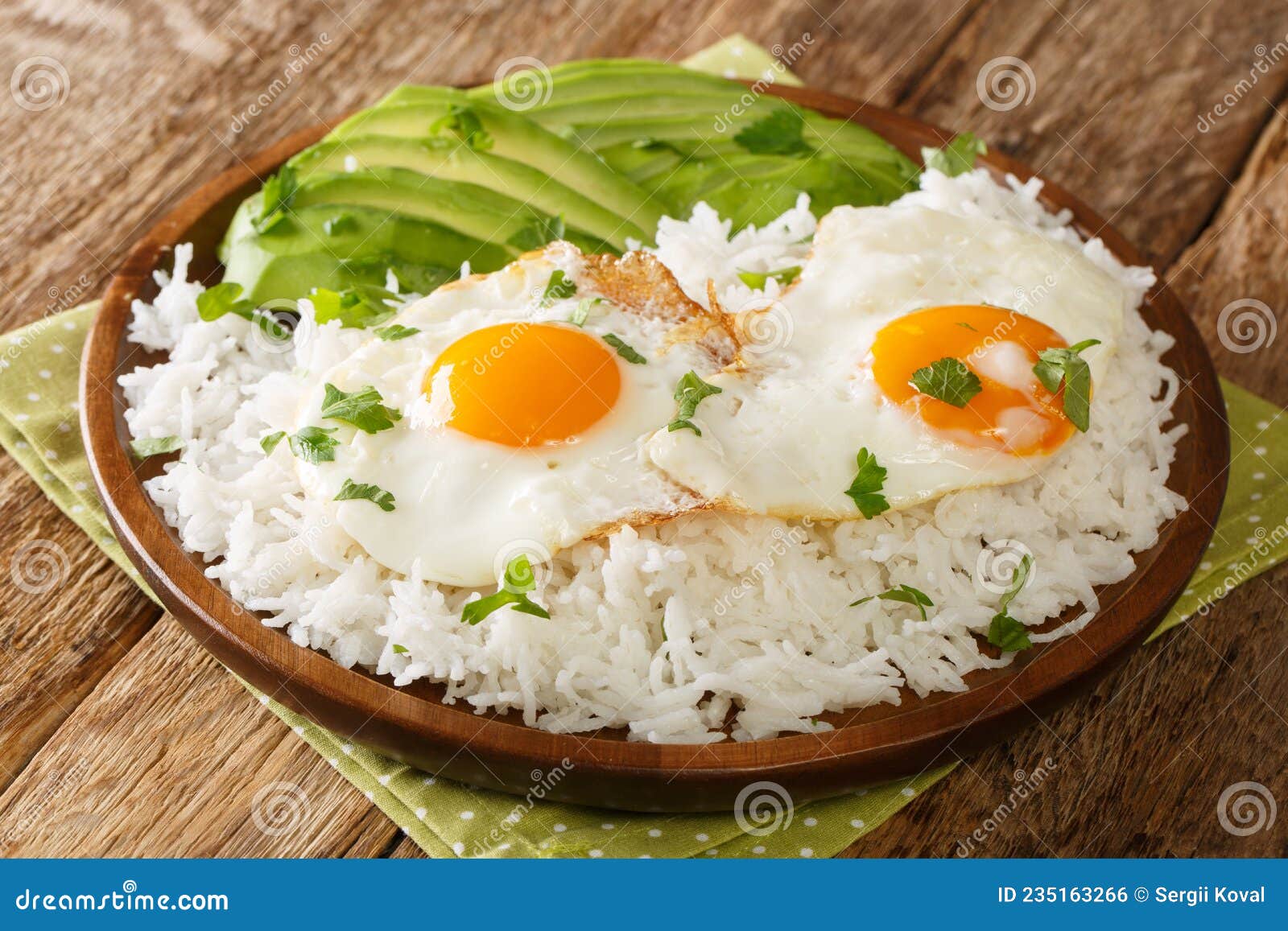 arroz con huevo is a popular lazy lunch throughout latin america, consisting of rice thatÃ¢â¬â¢s topped with a fried egg close up in