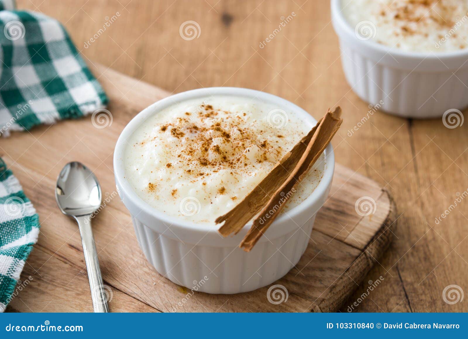 arroz con leche. rice pudding with cinnamon on wood