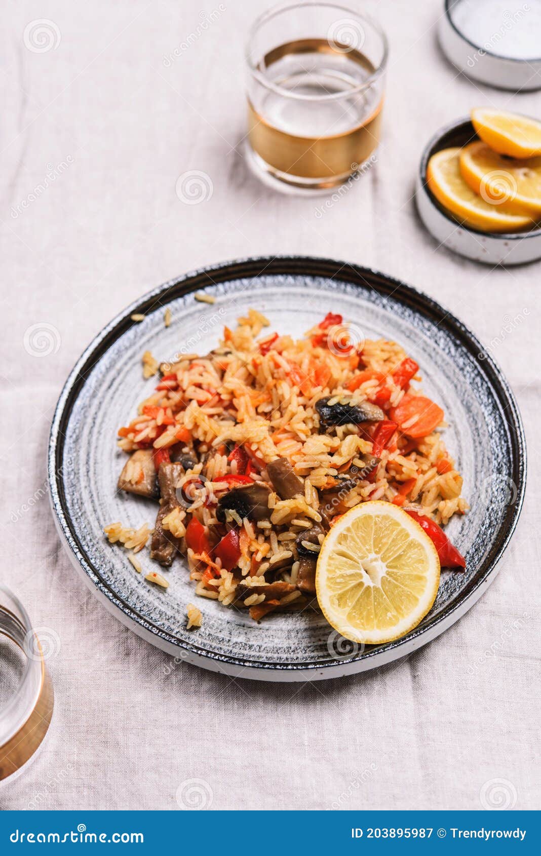 arroz con verduras y azafran, spanish dish. vegetarian risotto with vegetables, champignons and saffron