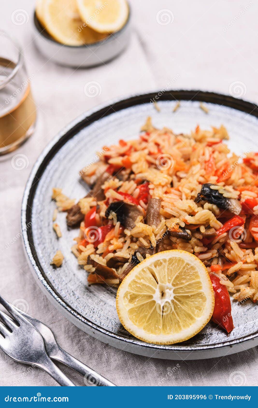 arroz con verduras y azafran, spanish dish. vegetarian risotto with vegetables, champignons and saffron