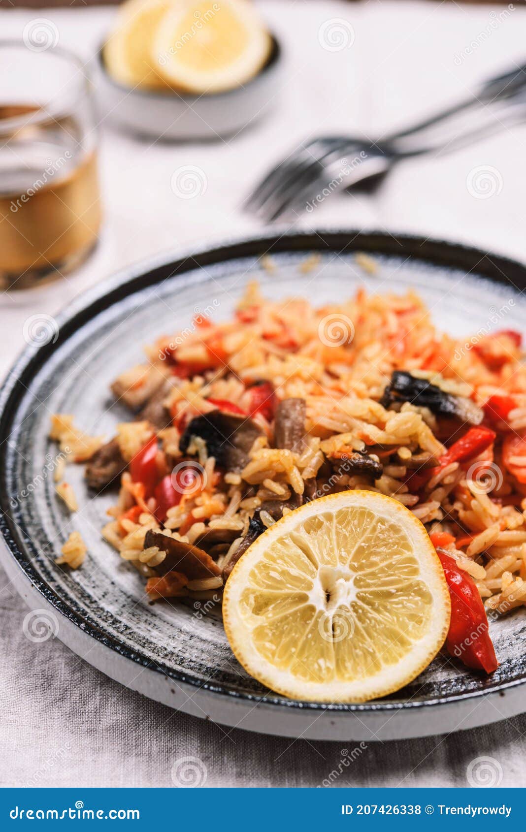 arroz con verduras y azafran, spanish dish. vegetarian risotto with  vegetables, champignons and saffron