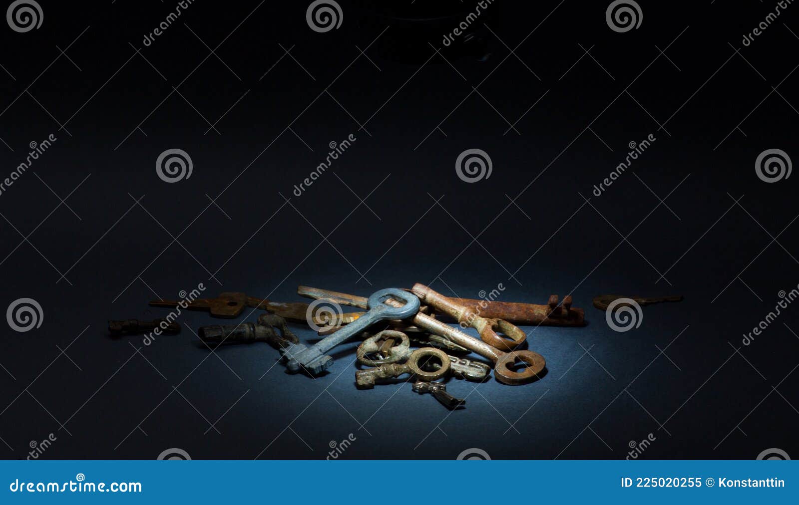 art bunch of old unnecessary keys on a dark background. obsolete technology concept