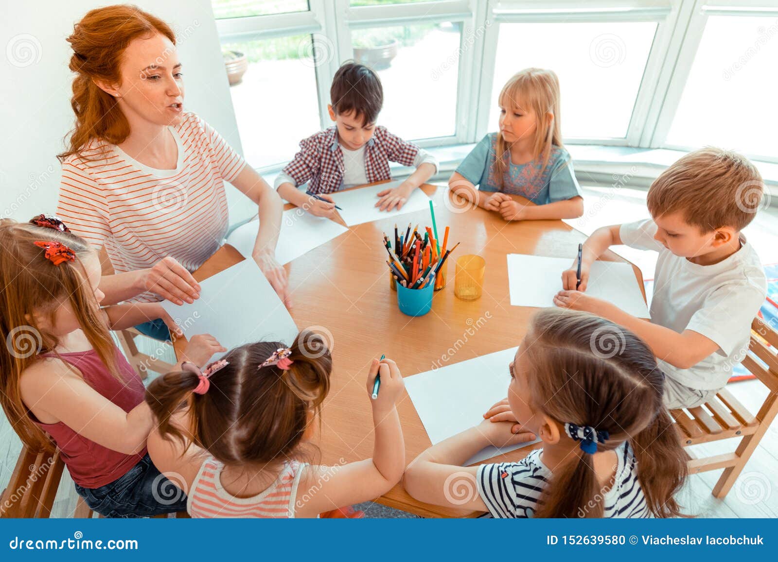 Nice Talented Children Sitting at the Table Stock Photo - Image of