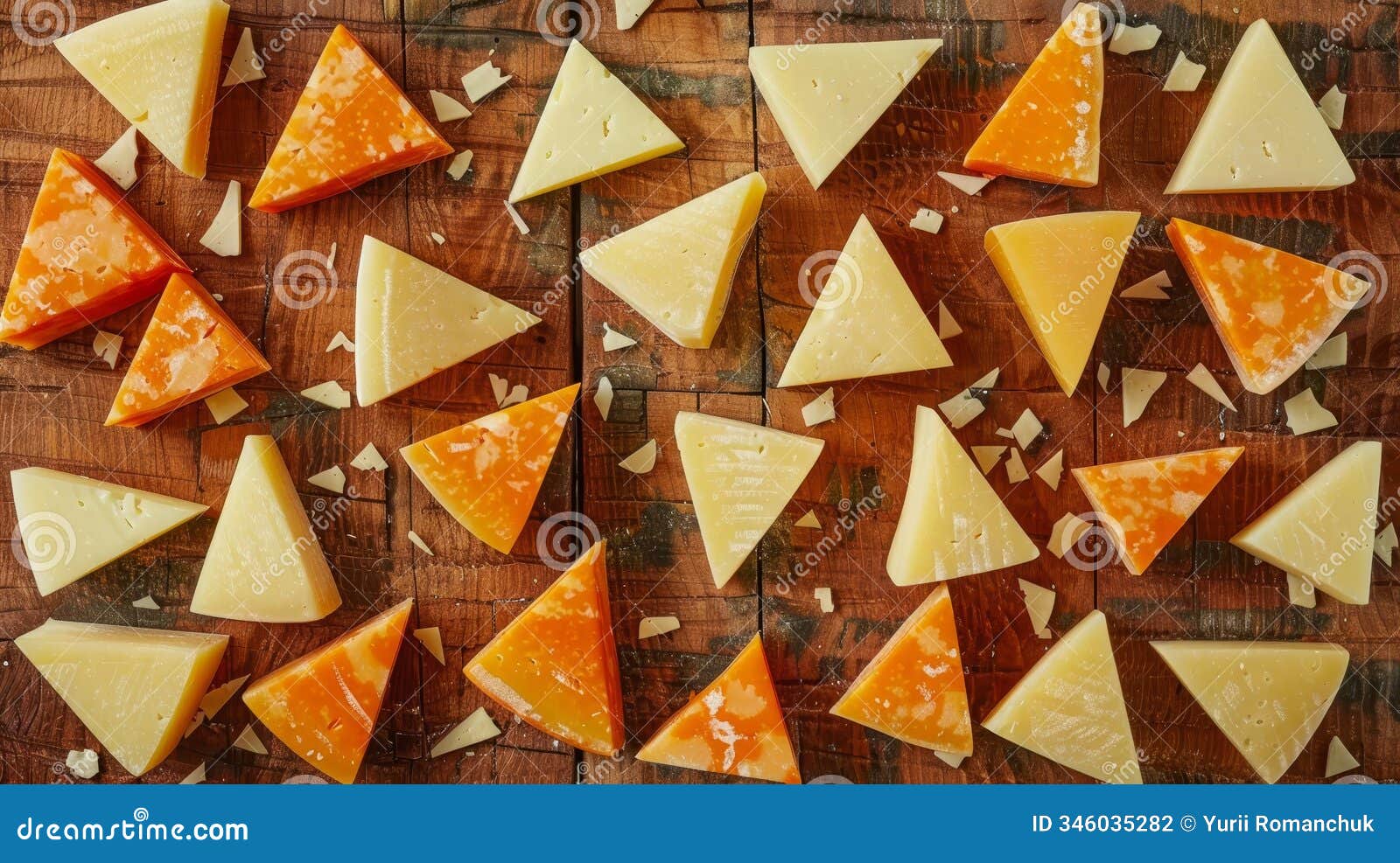 artful arrangement of textured triangular cheese chunks on a rustic wooden table