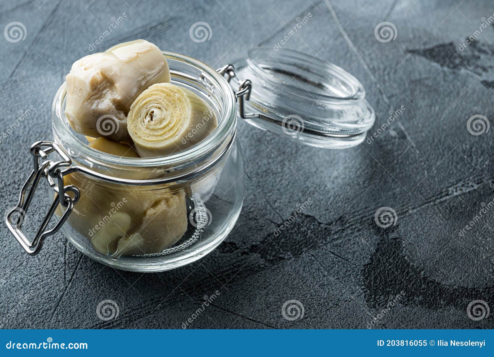 Artichoke Hearts Marinated in Olive Oil, on Grey Background Stock Image