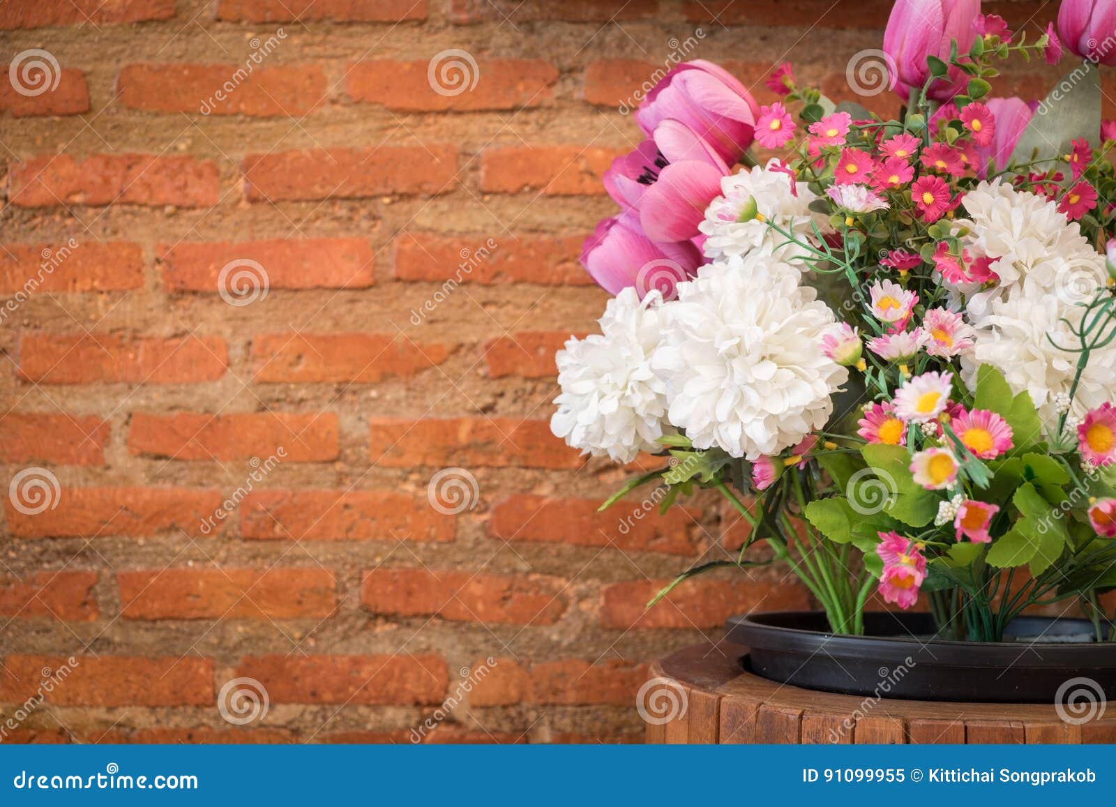 Artificial Flowers and Brick Wall. Stock Image Image of plant