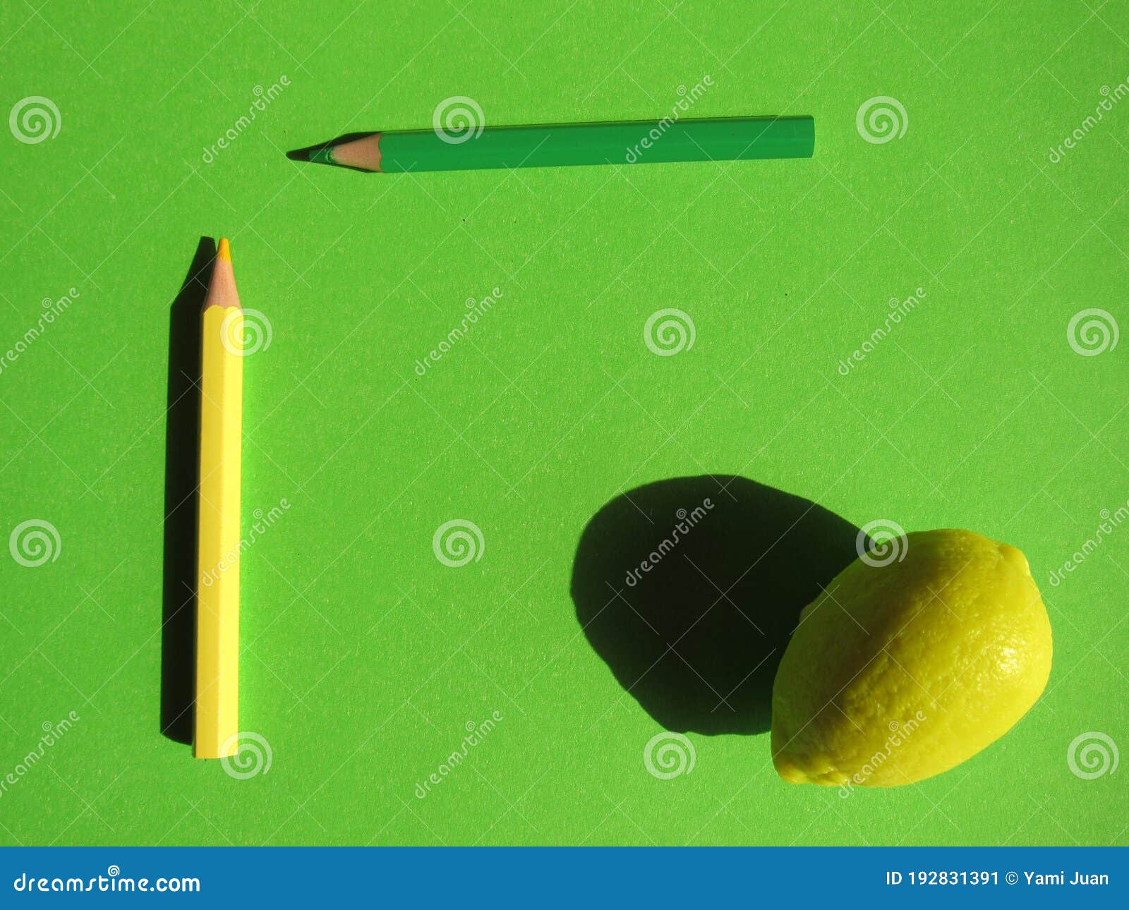 Artificial Lemon and Pencils on a Green Background Stock Image Image