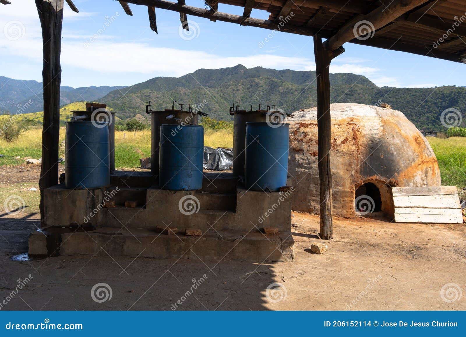 artisanal oven and fermentation equipment in the field to make tequila and raicilla.