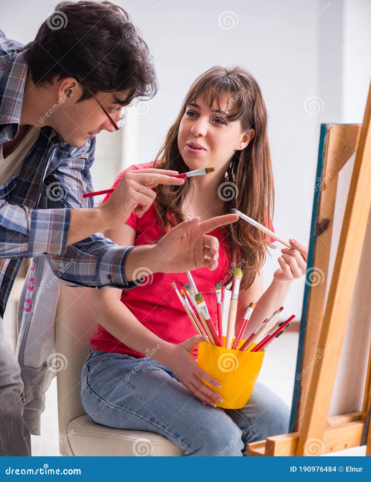 Artist Coaching Student in Painting Class in Studio Stock Photo Image