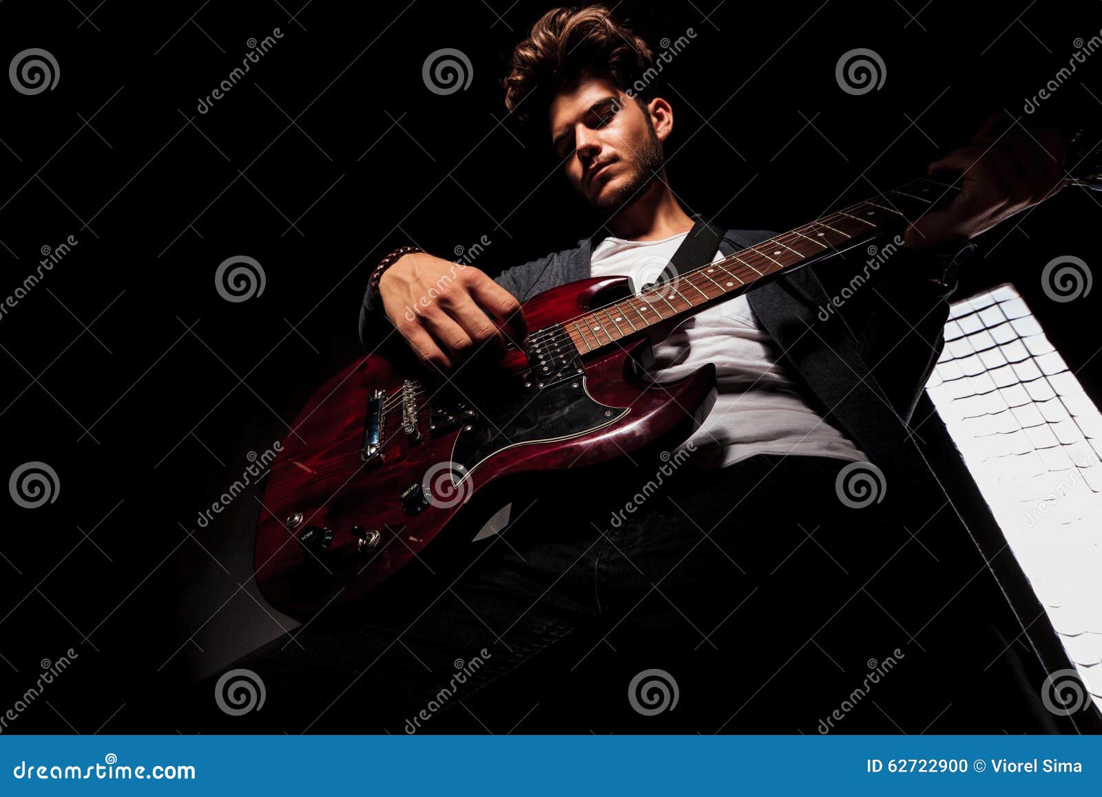 Artist in Dark Backgroud Playing Guitar Stock Photo - Image of guitar ...