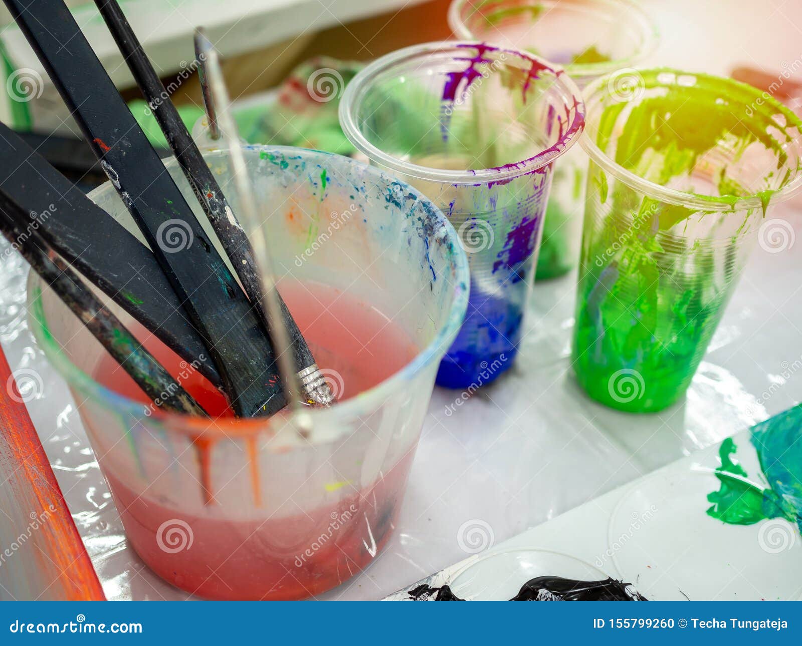 Artist Paint Brushes in White Bucket of Water, Acrylic Colour in Plastic  Cups Stock Photo - Image of brushes, concept: 155799260