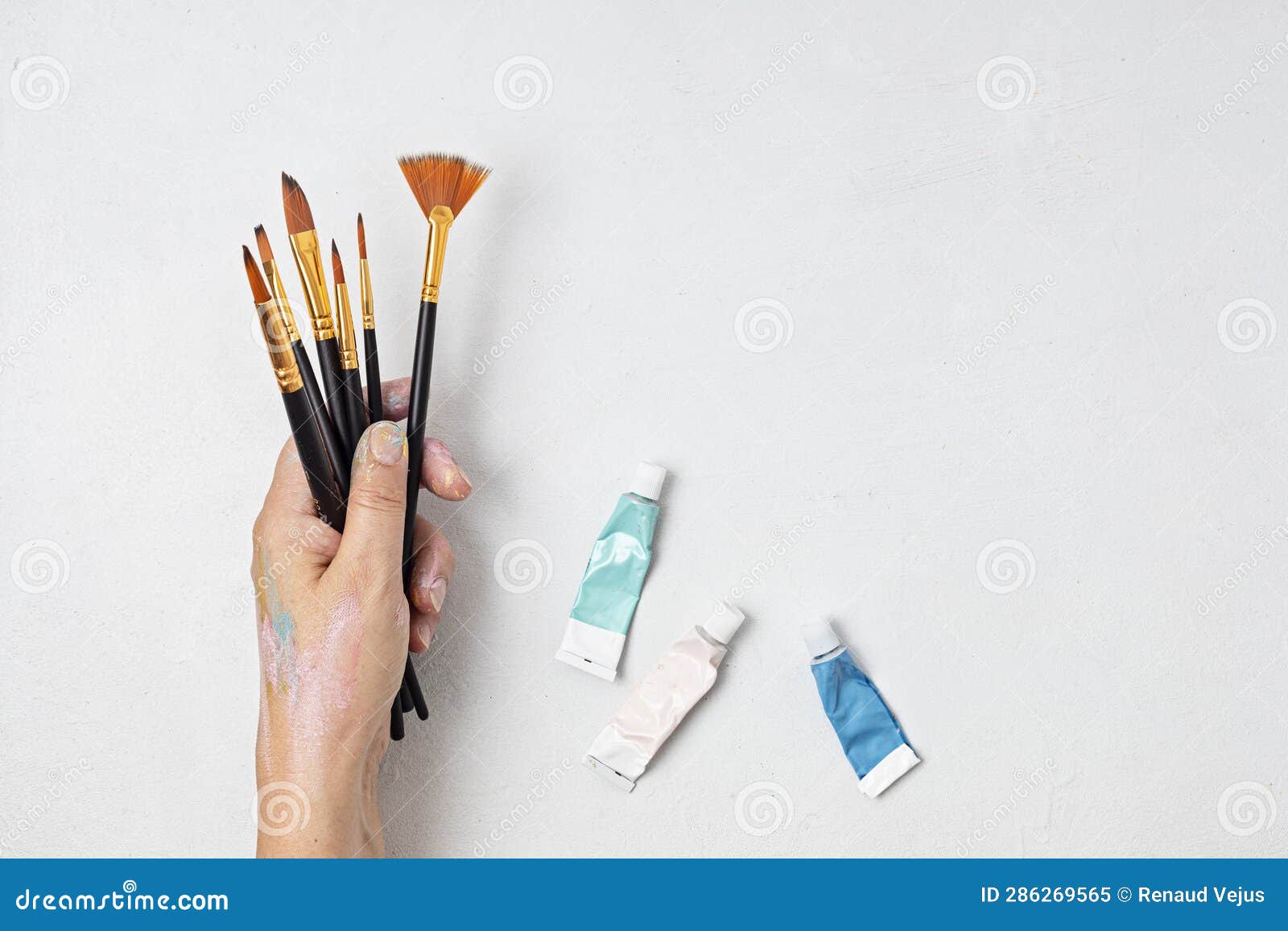 artist painting colors with brushes. craft hobby background.