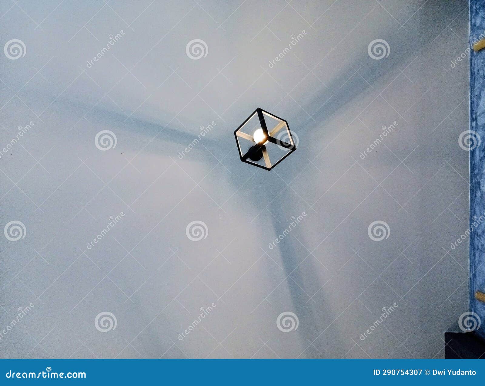 enchanting ambiance: artistic hanging lamp and its dramatic shadow