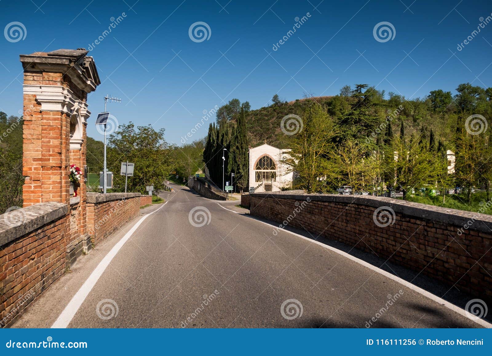 asciano, tuscany, italy - the garbo bridge over the ombrone rive