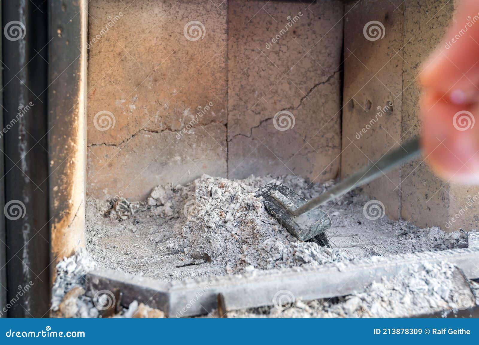 Removing the Ashes in a Fireplace with a Broom Stock Image Image of