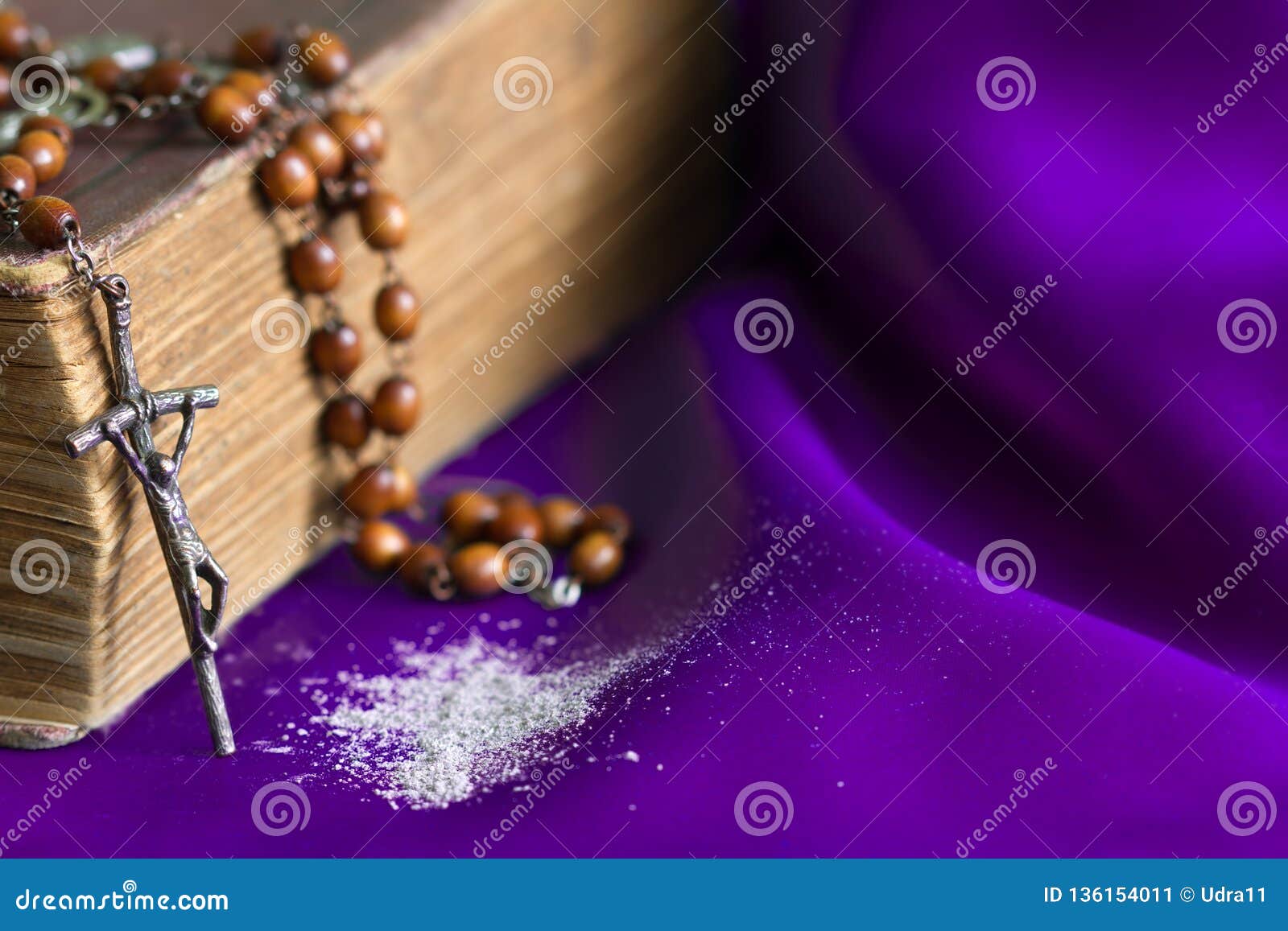 ash wednesday religion concept on violet fabric background with rosary