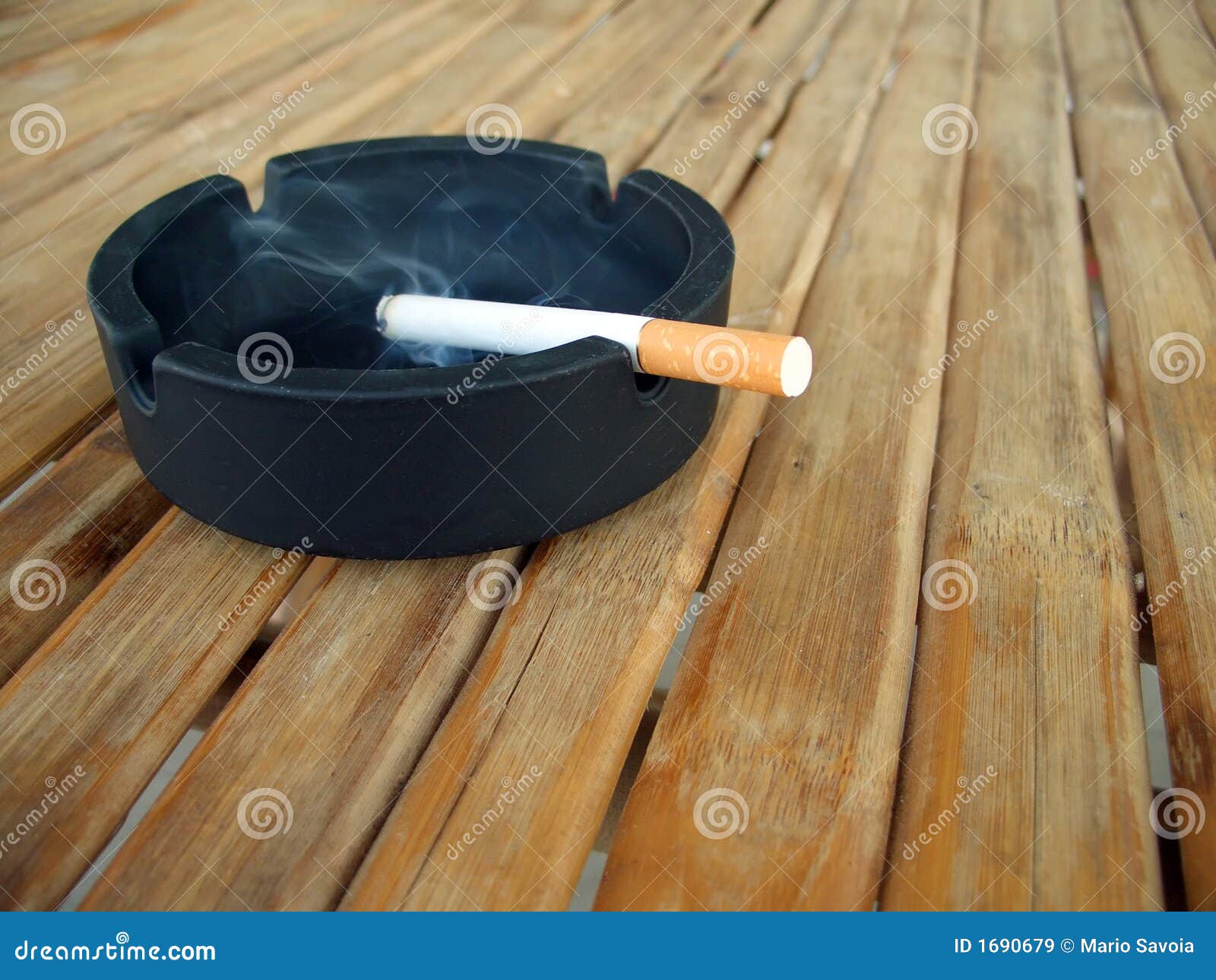 Ashtray with lit cigarette stock image. Image of close 1690679