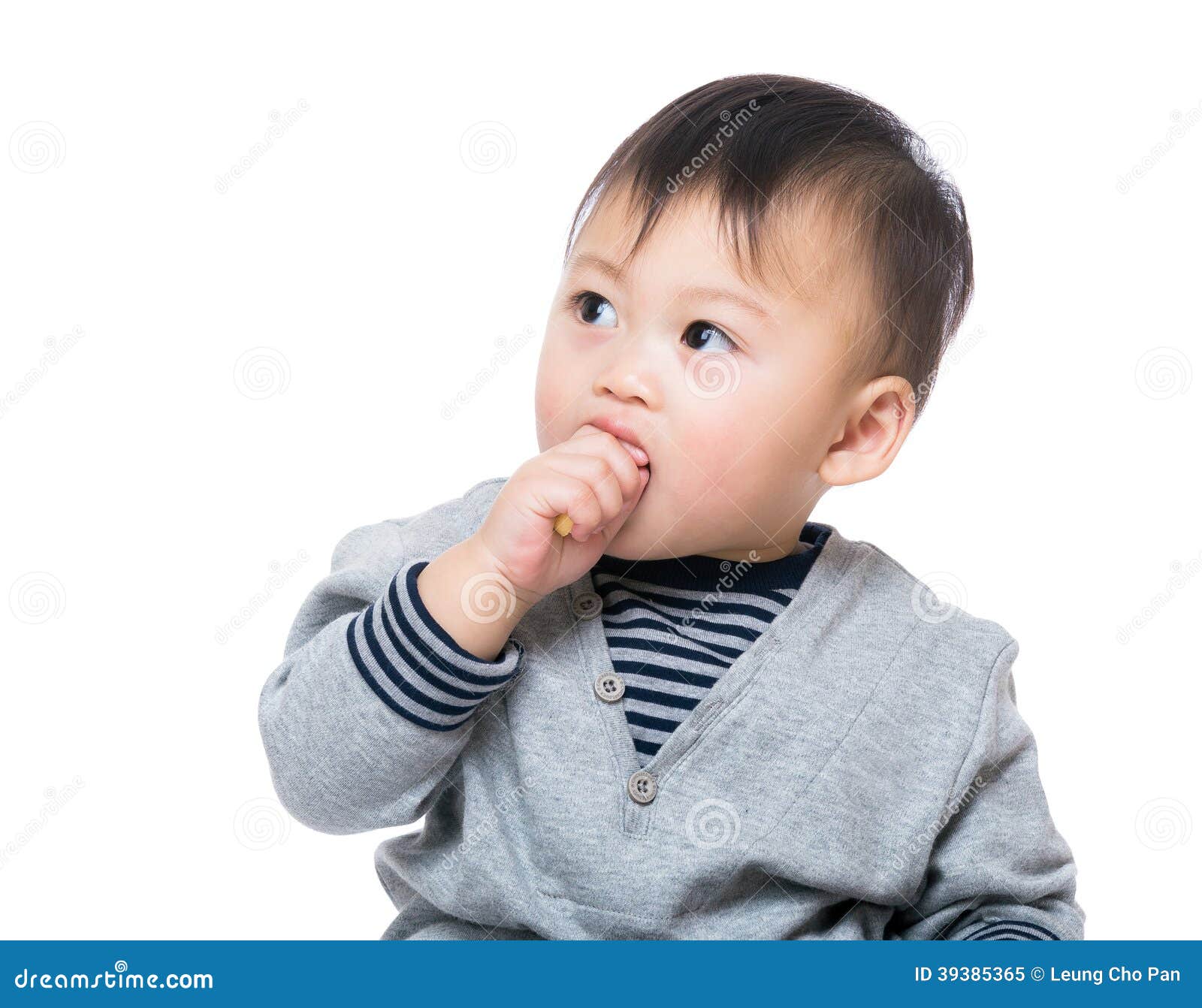 Asia baby boy eating biscuit isolated on white