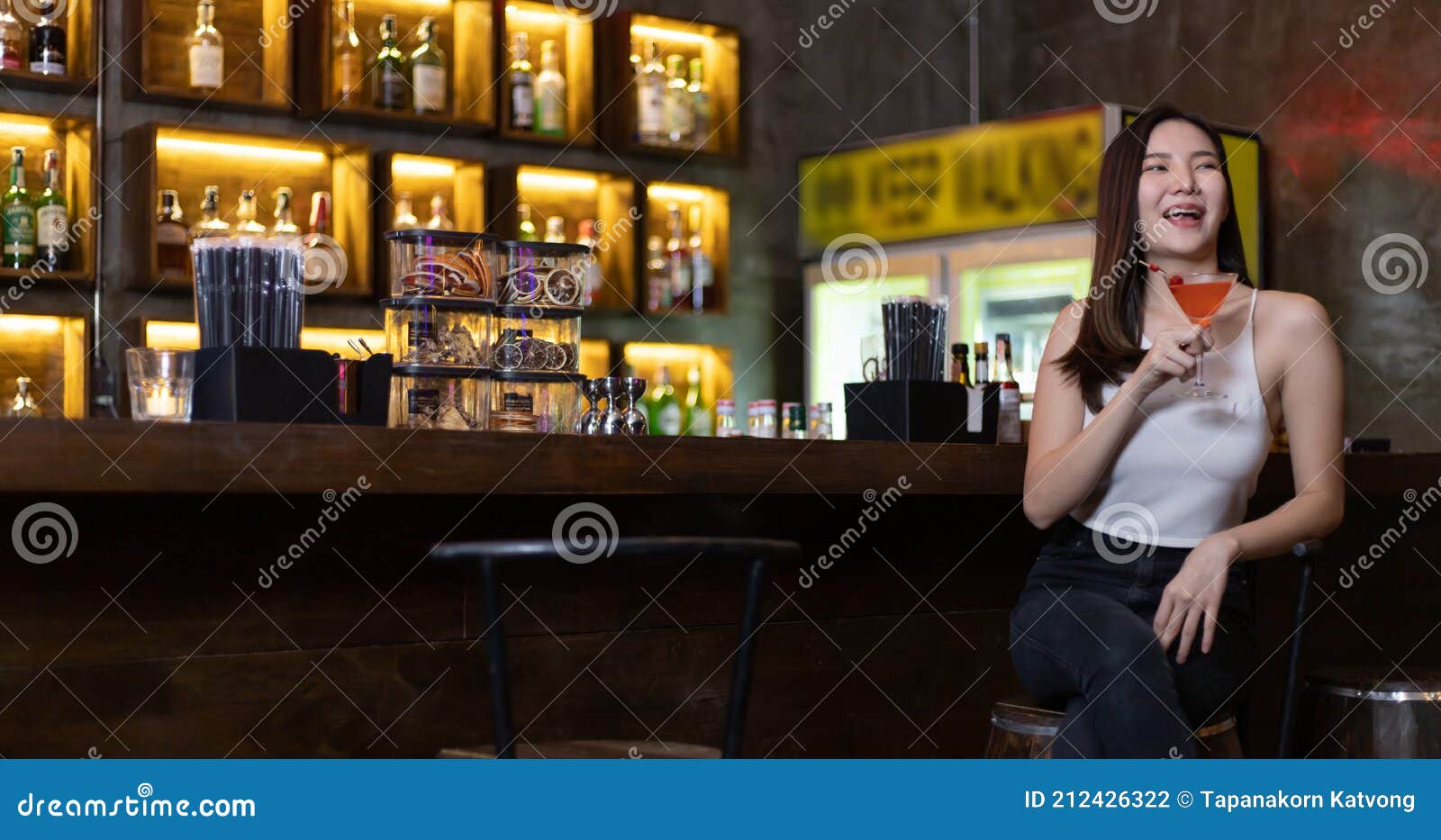 Asian Alone Women Enjoy Cocktails in Front of a Vintage Bar, Relaxing ...