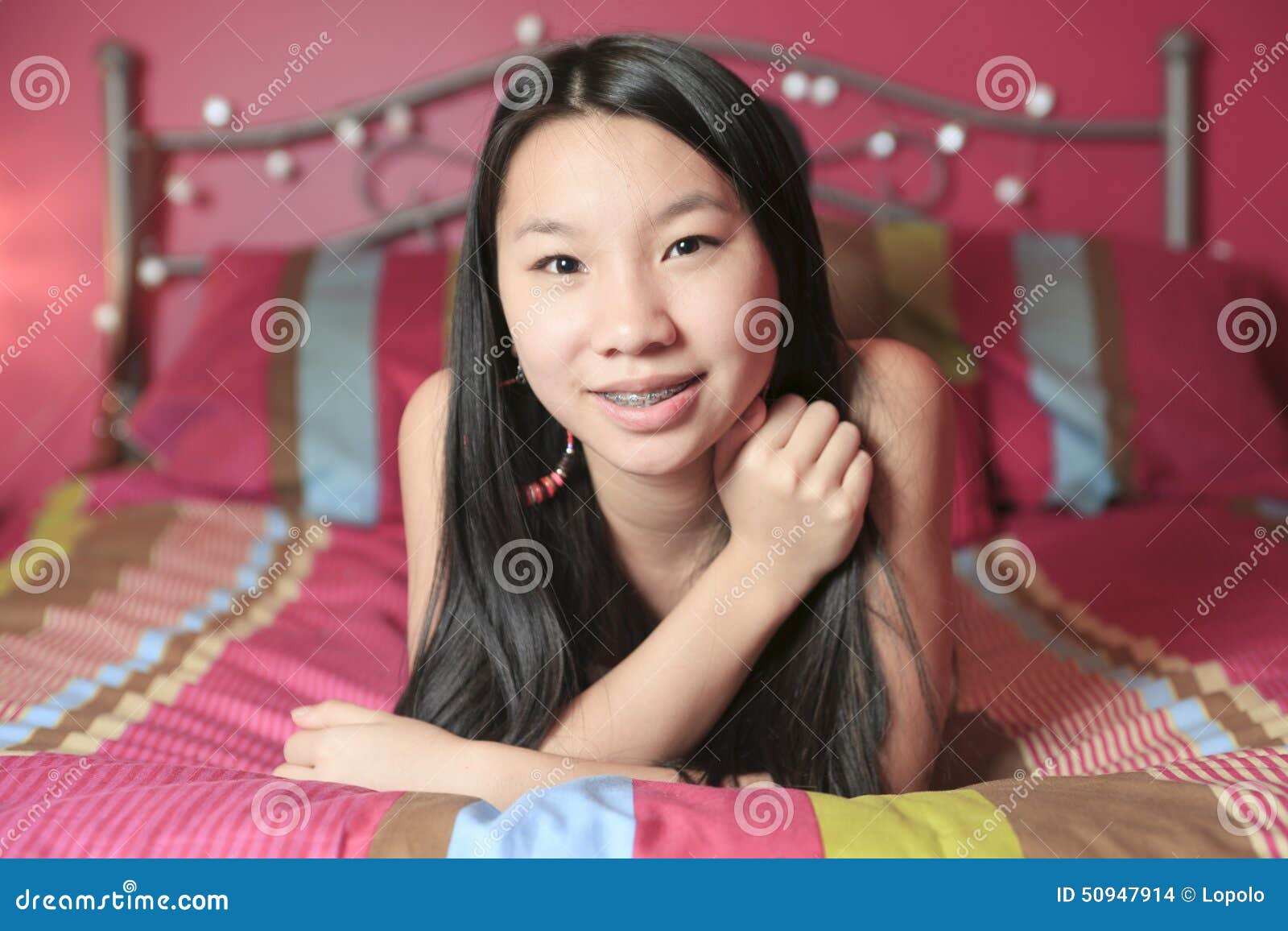 Asian American Teen Lay On His Bedroom Stock Photo Im