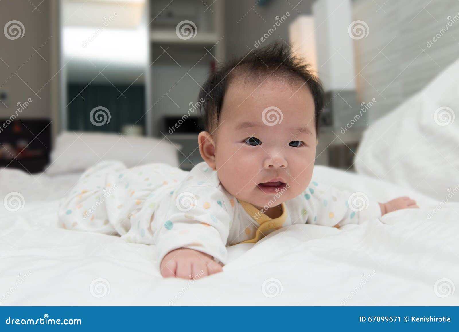 Asian baby on bed stock image. Image of person, chinese 67899671
