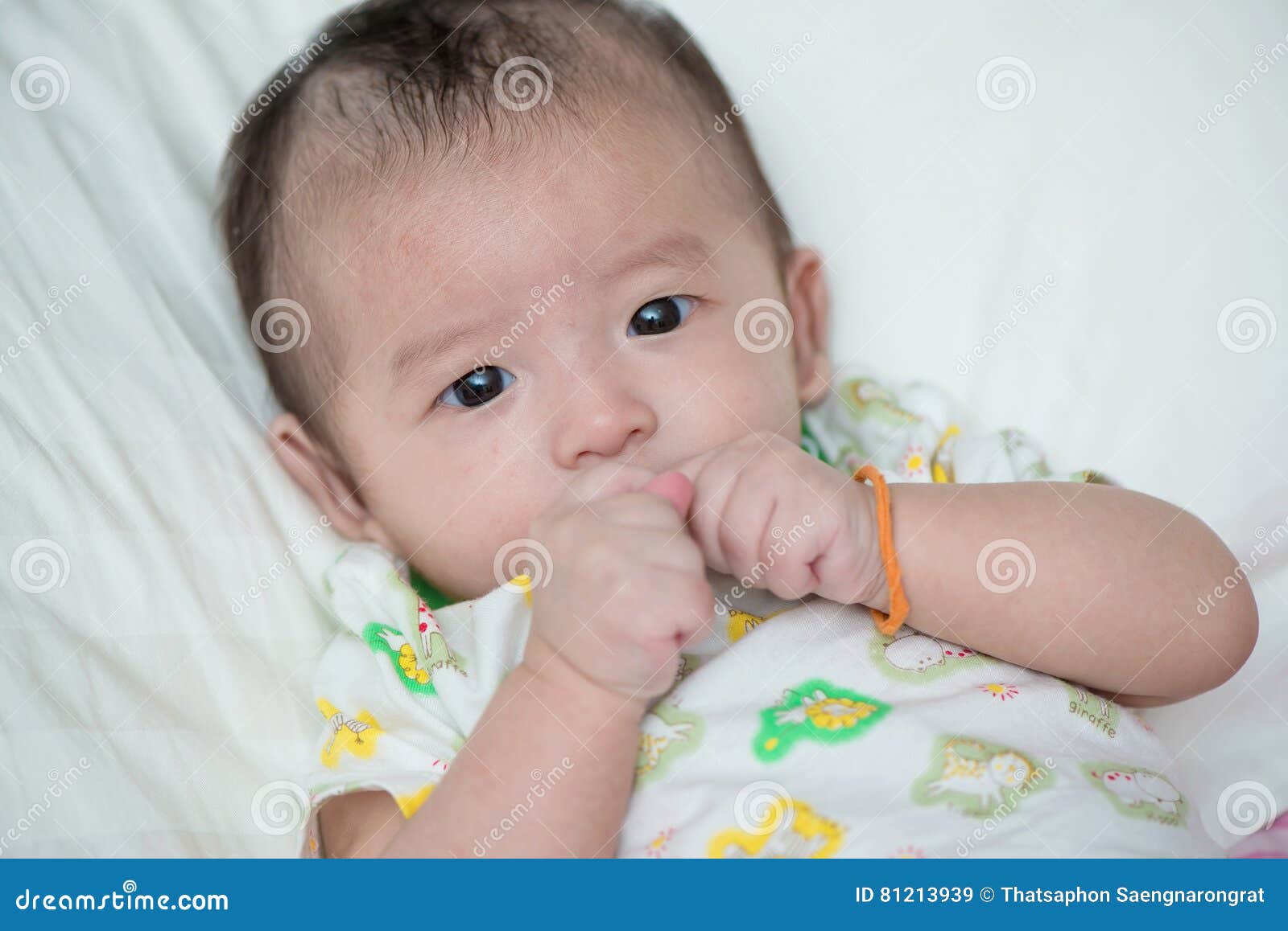Asian baby on the bed stock image. Image of cheerful 81213939