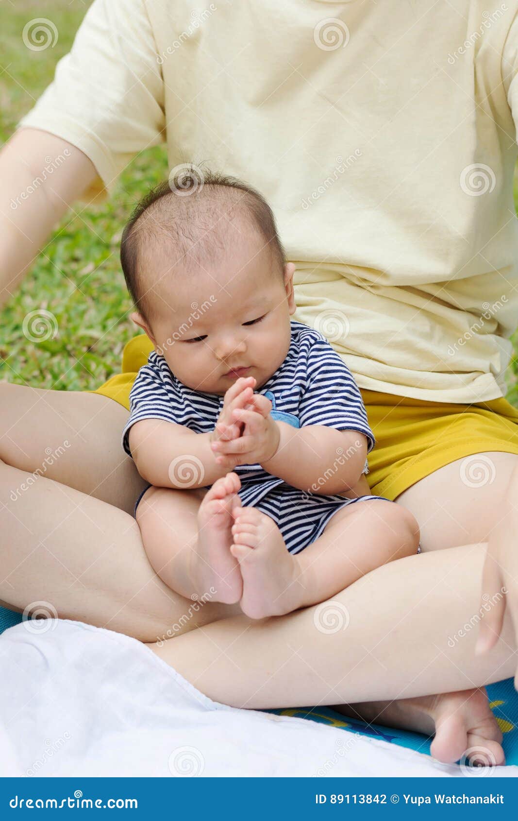 Asian Baby Enjoy Playing With He
