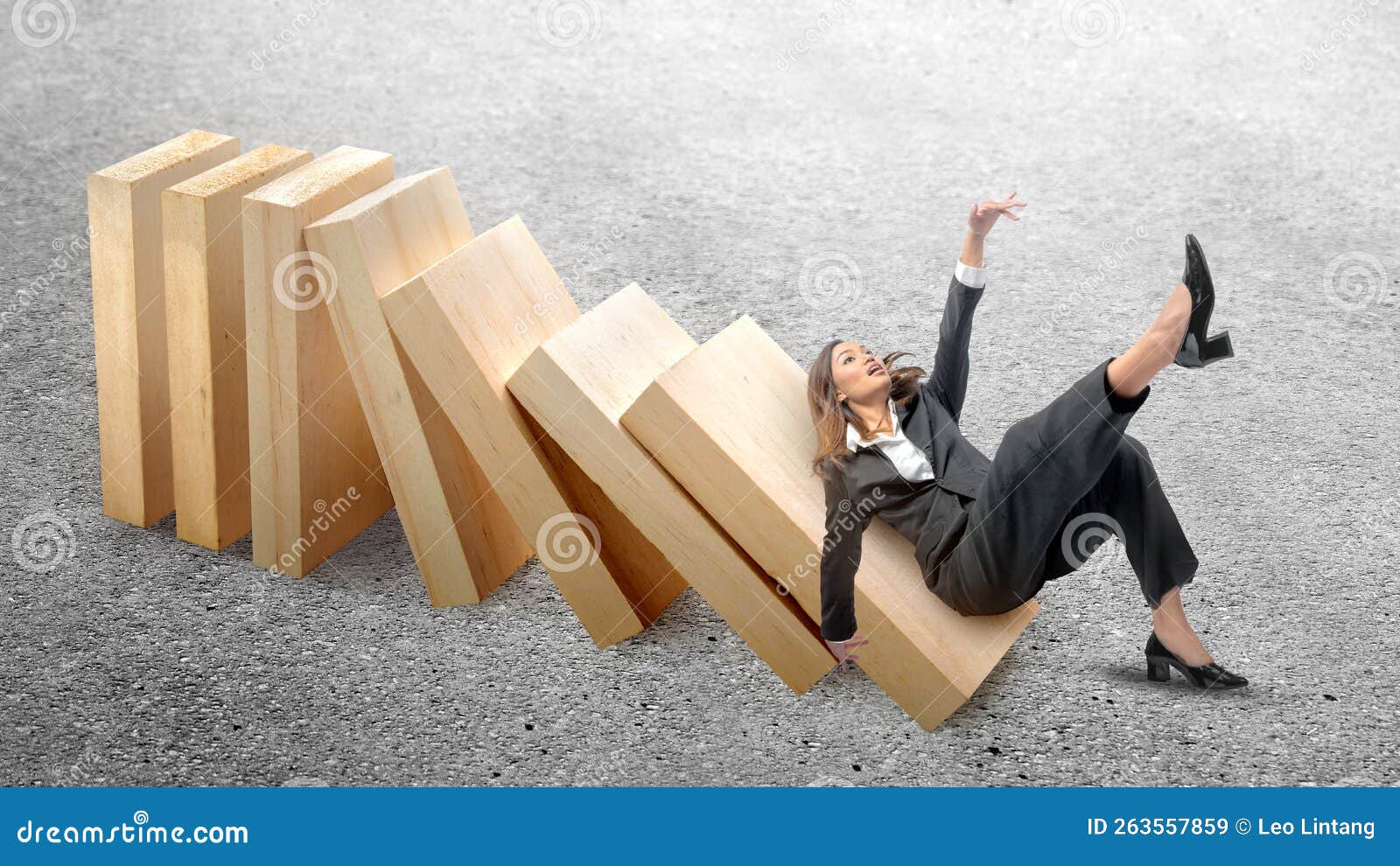asian businesswoman slipped on topple wooden block