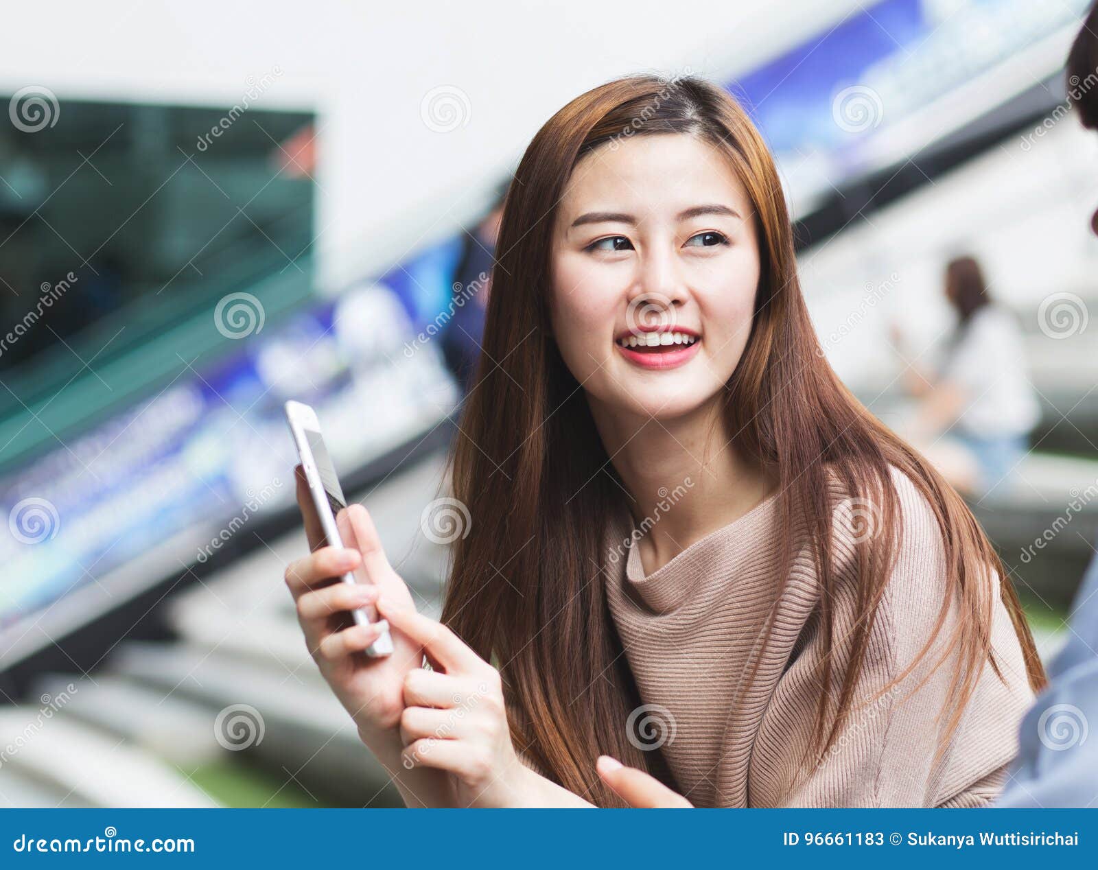 https://thumbs.dreamstime.com/z/asian-charming-female-smiling-presenting-cell-phone-to-another-asian-charming-female-smiling-presenting-cell-phone-to-96661183.jpg