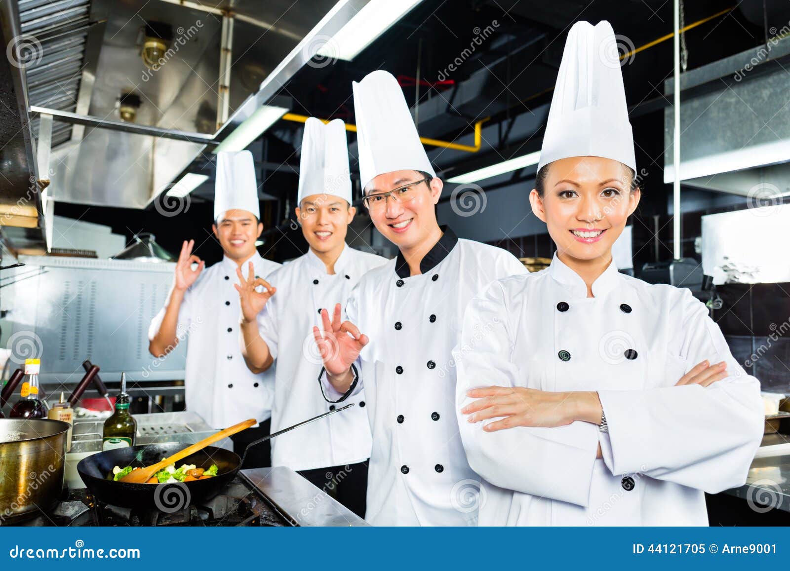 Asian Chefs In Hotel Restaurant Kitchen Stock Photo 