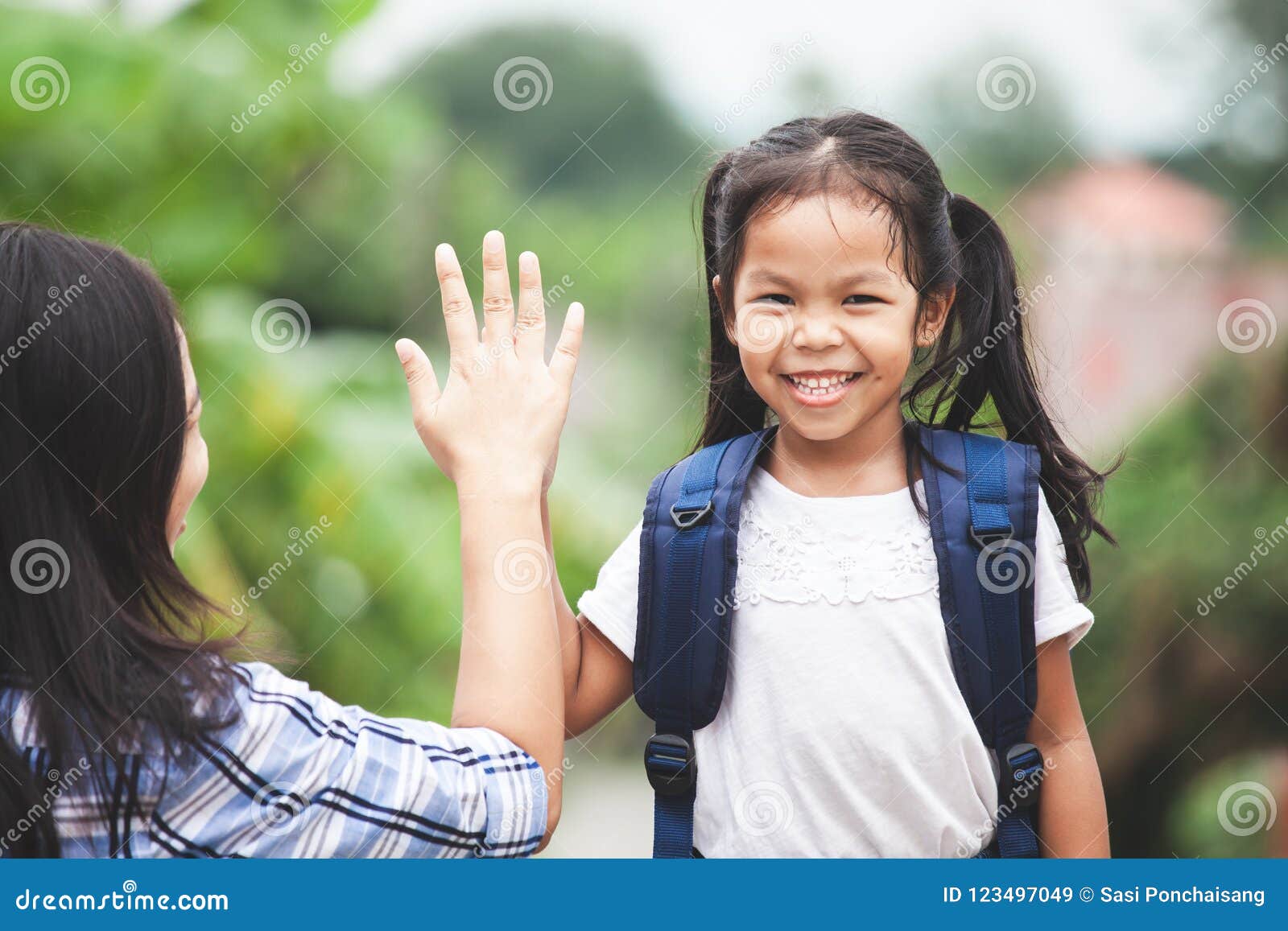 Asian Child Girl with School Bag and Her Mother Making Hi Five Stock ...