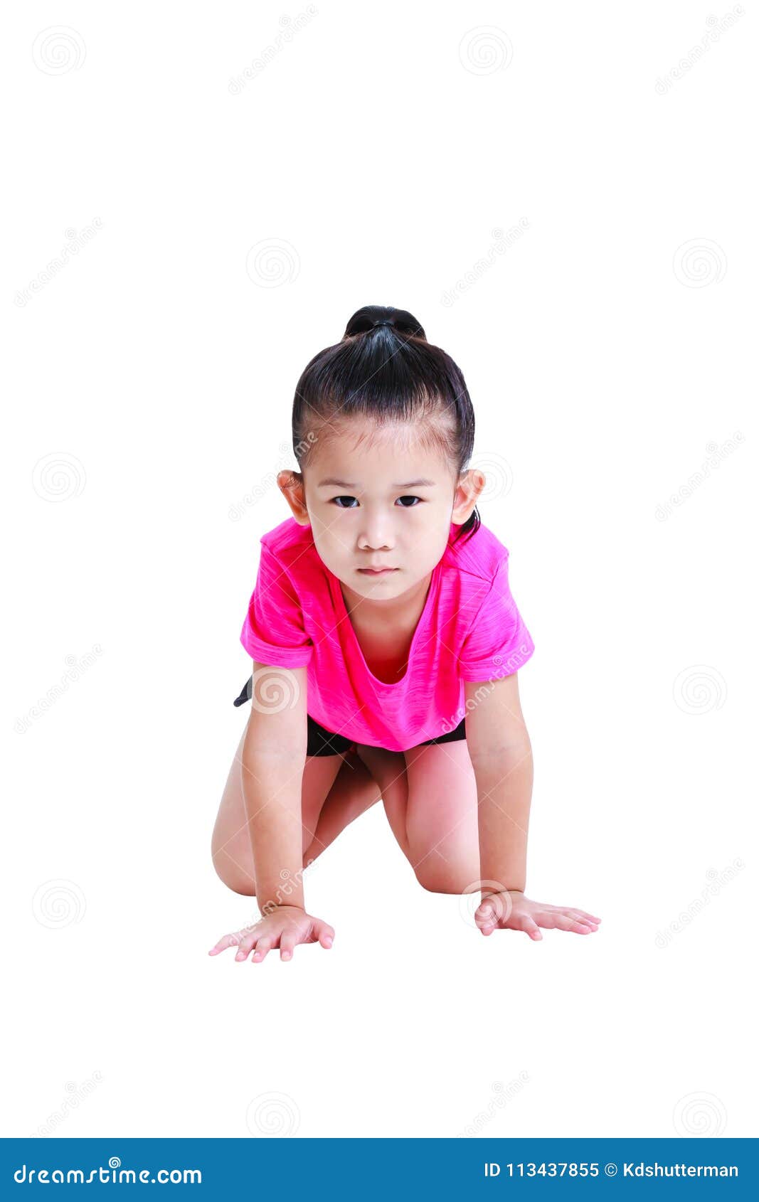 asian child in sportwear crawling on knees at studio.