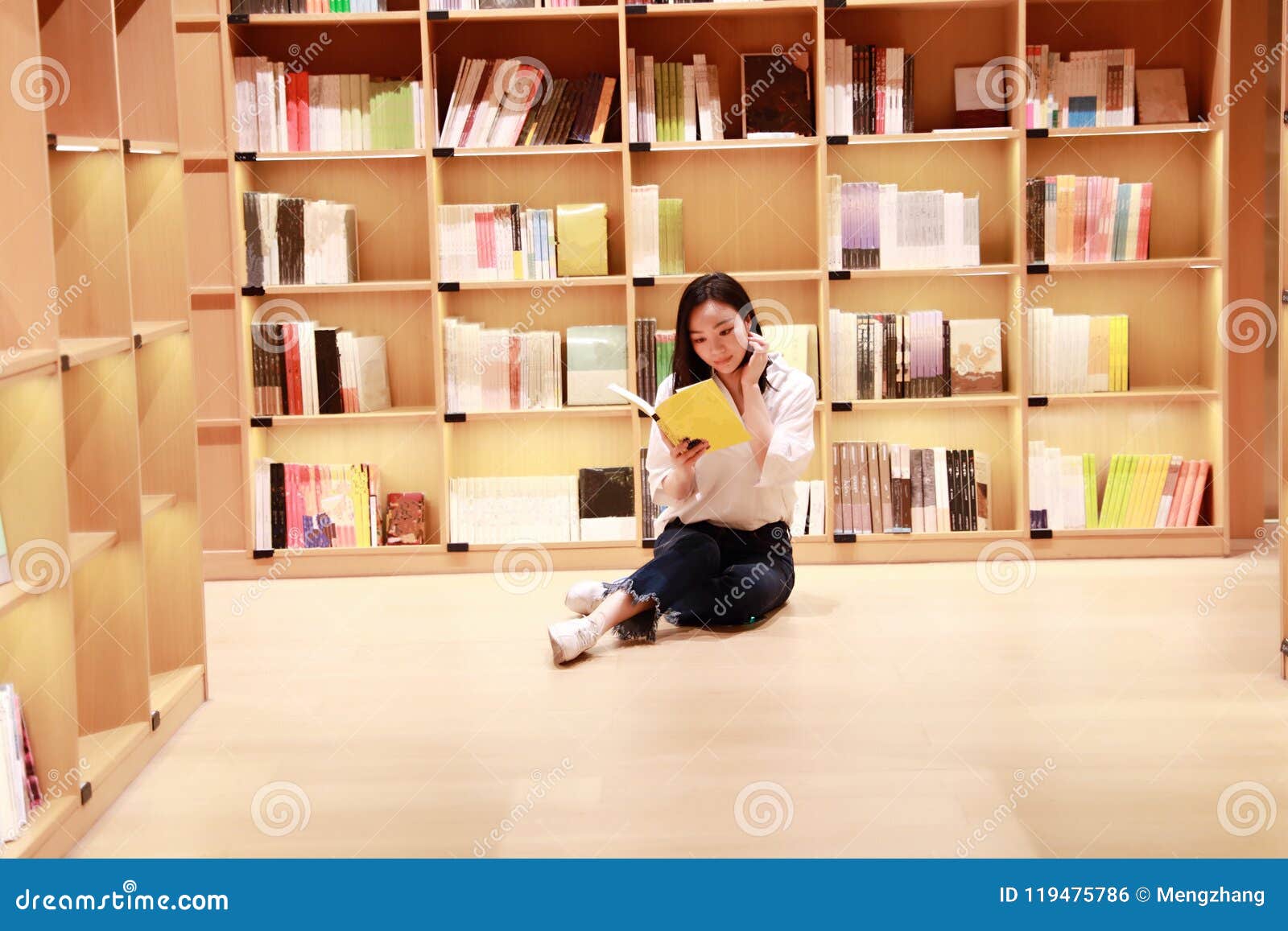 asian chinese beautiful pretty cute woman girl student teenager read book in bookstore library