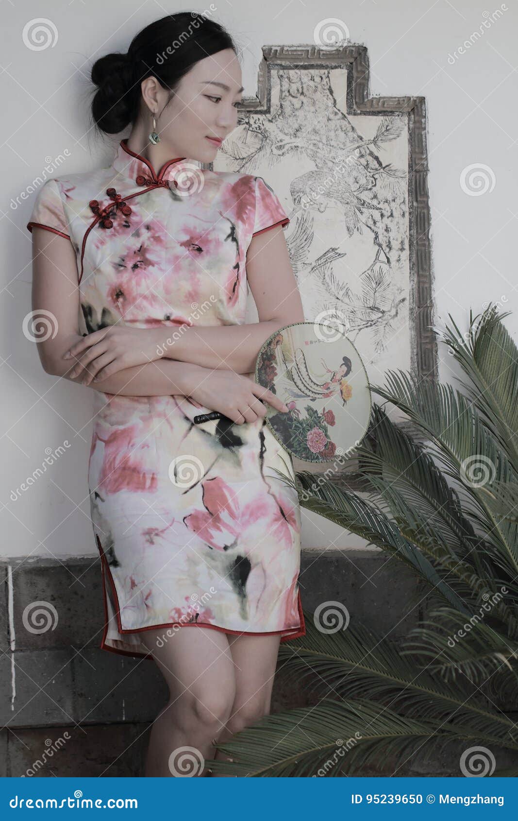 asian chinese girls wears cheongsam enjoy free time in ancient town