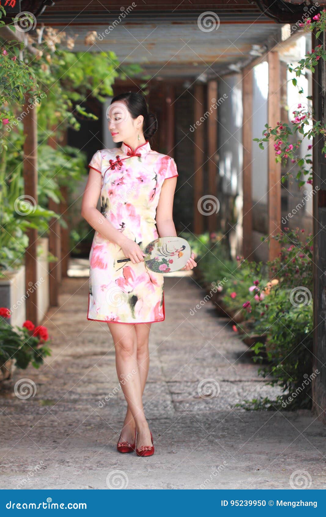 asian chinese girls wears cheongsam enjoy free time in ancient town