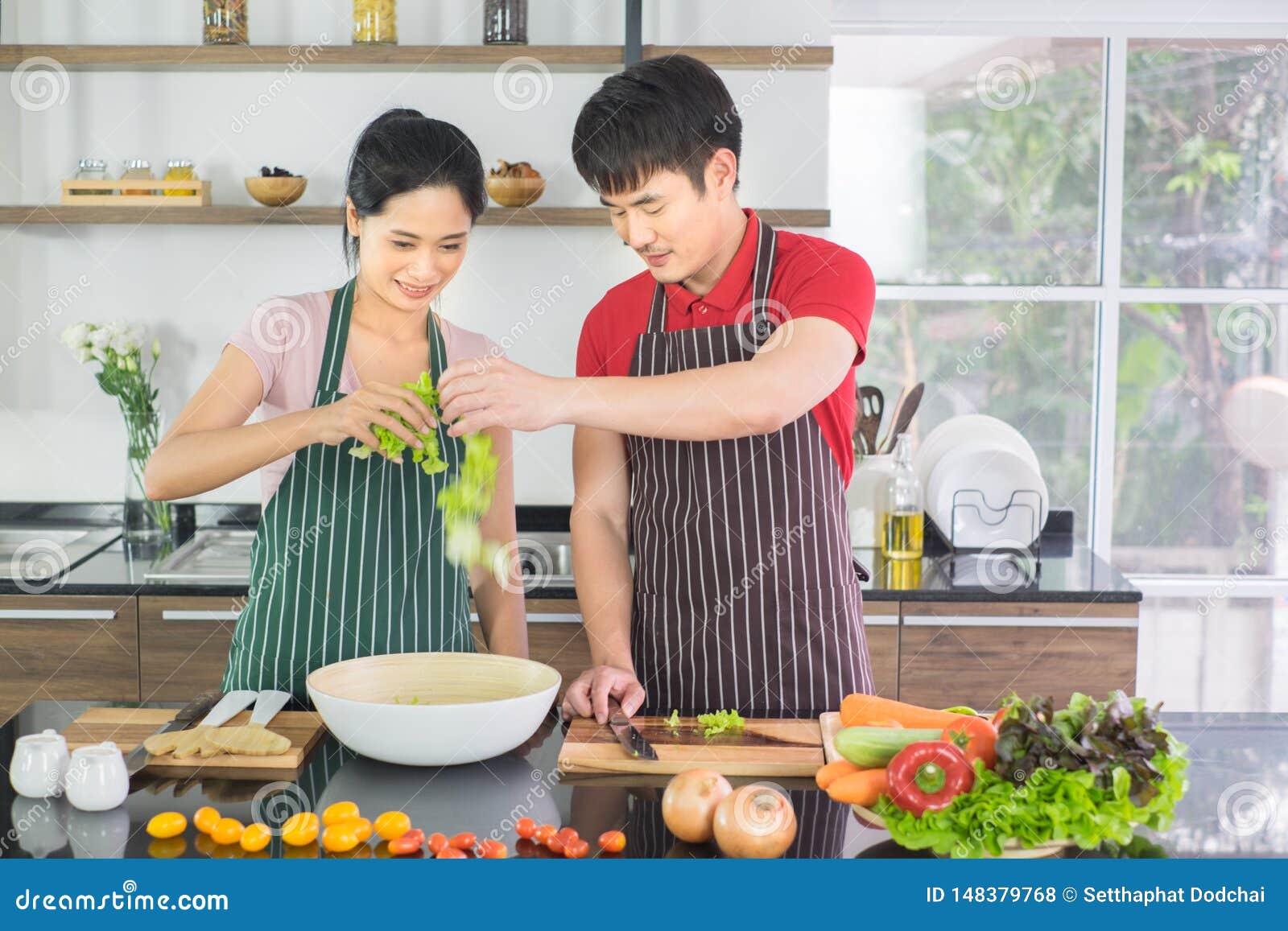 Asian Couple They Both Made A Happy Salad Together In The Kitchen At
