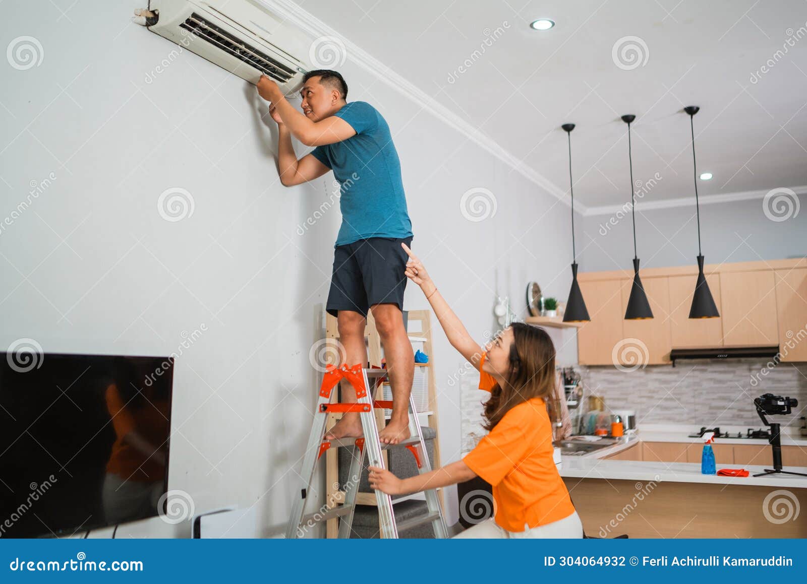 asian couple repair broken airconditioner together
