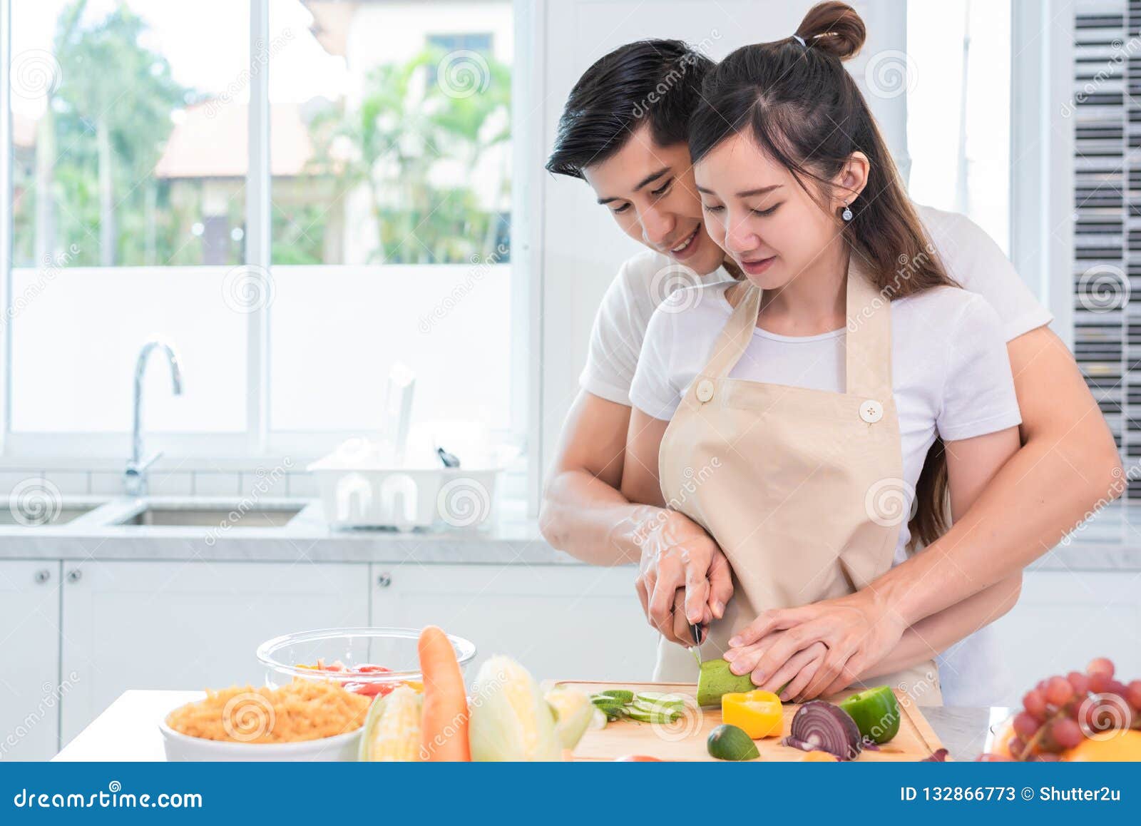 Asian Couples Cooking And Slicing Vegetable In Kitchen Together Stock Image Image Of Home
