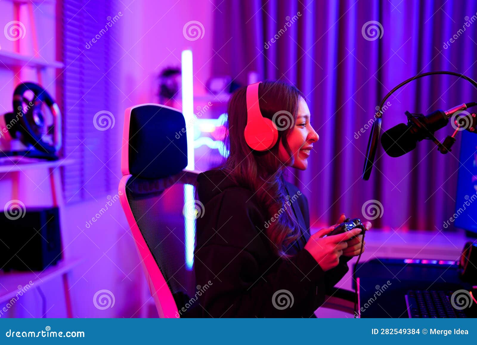 Asian Cute Girl Streaming Play Game Online Using Controller and Talking  with Fan Club from Microphone and Headset in Gamer Neon Stock Photo - Image  of internet, cheerful: 282549384