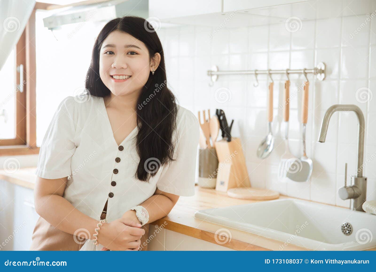 Asian Cute Girl Teen Smiling In The Kitchen For Asia Young House Wif