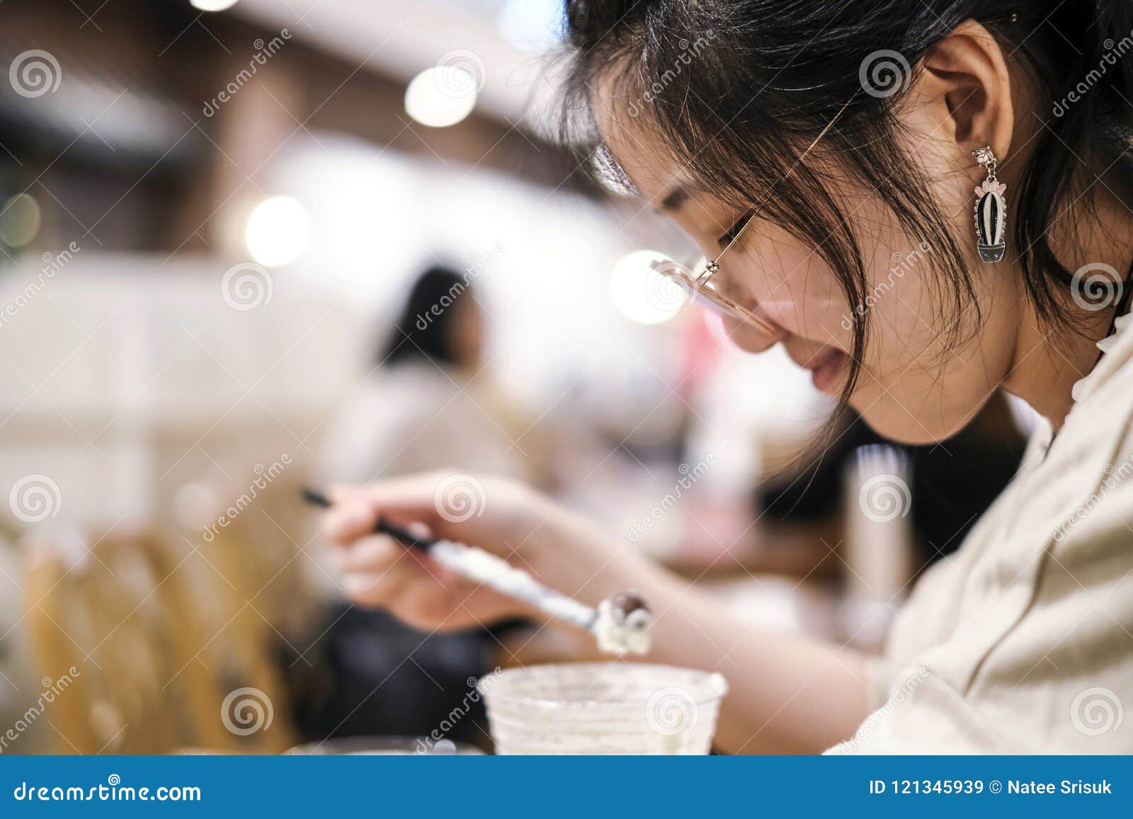 asian cute woman drinking chocolate frappe in cafe shop