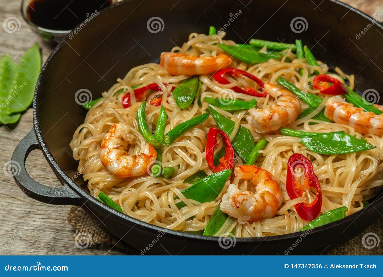 Asian Dish of Fried Rice Noodles with Shrimp and Vegetables Stock Photo