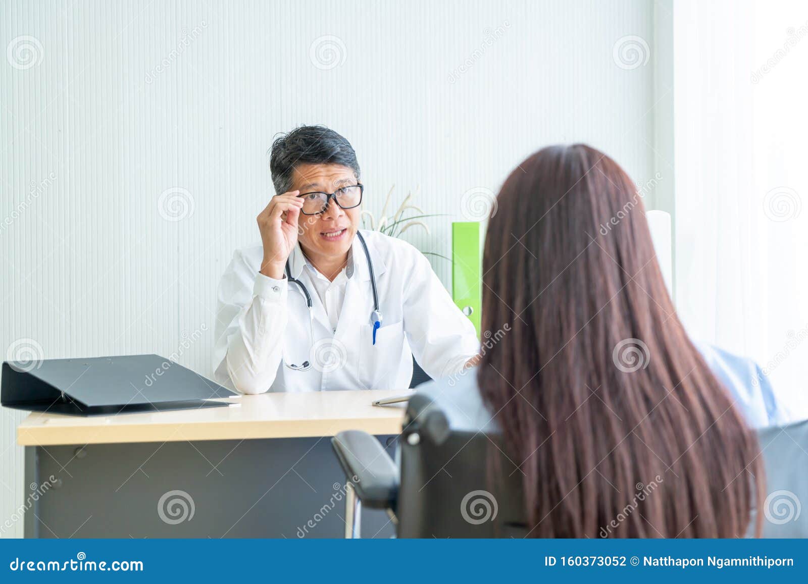Asian Doctor And Patient Are Consultation Stock Photo Image Of