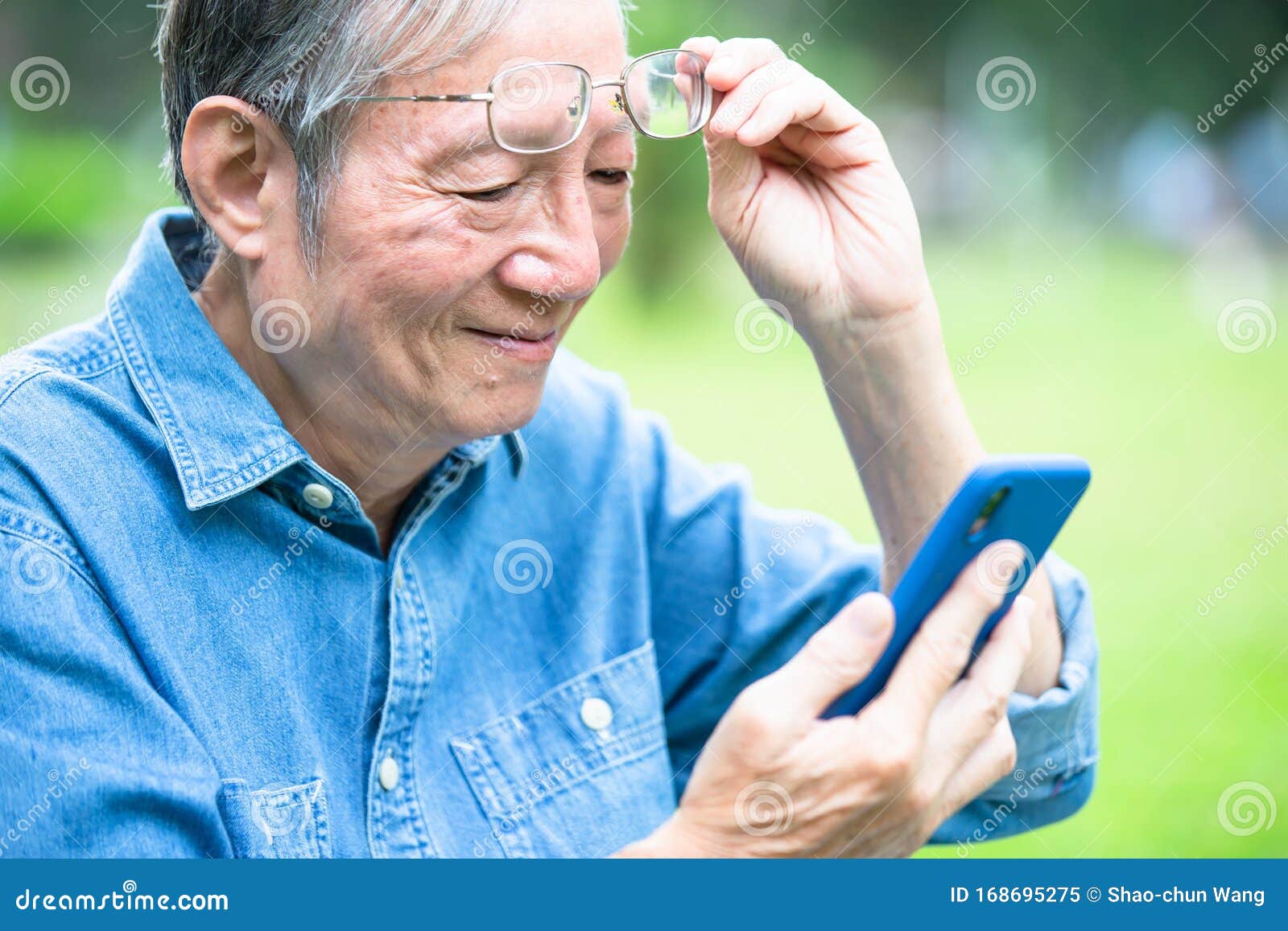 asian elder man has presbyopia