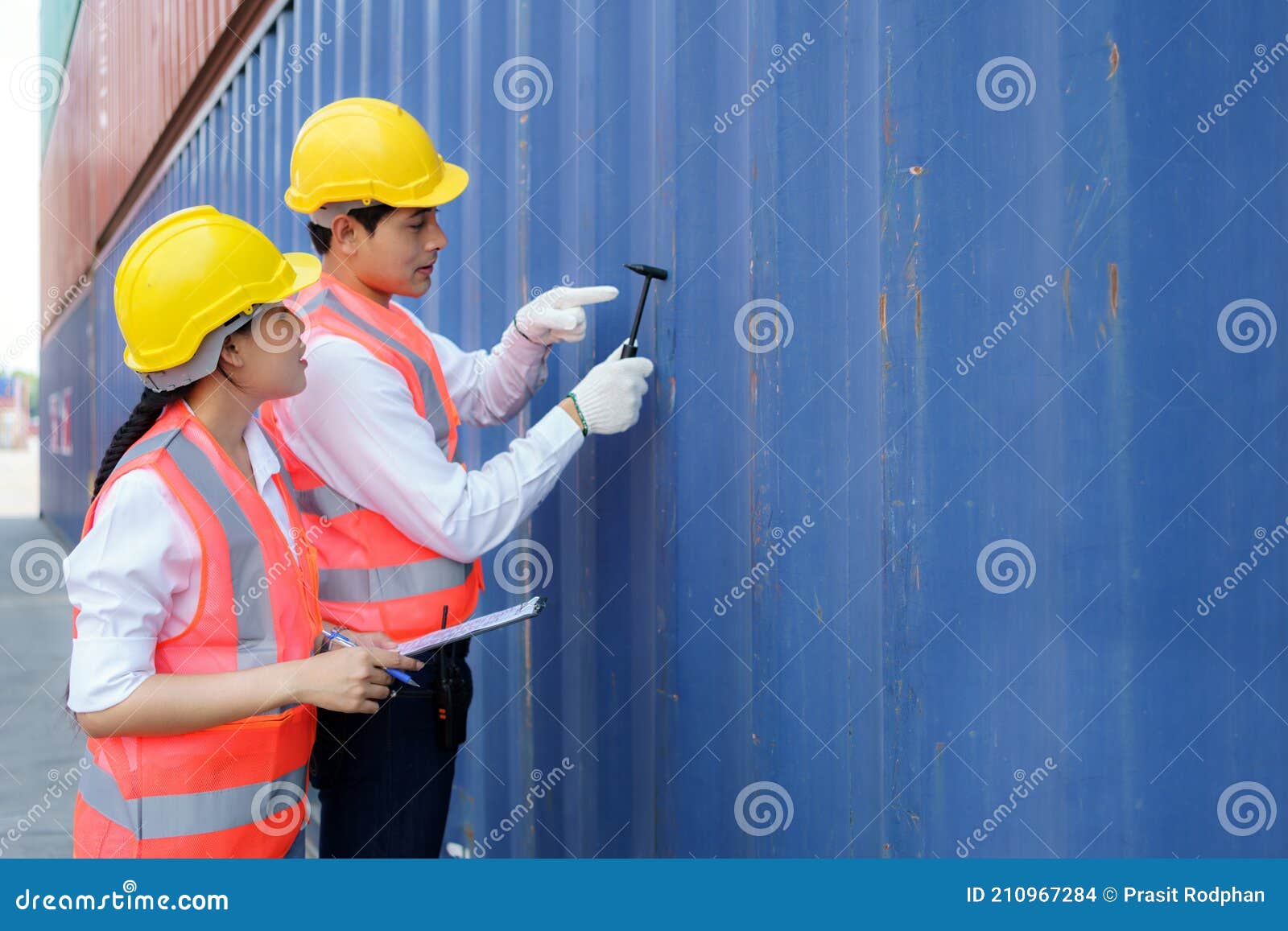 Asian Engineer or Foreman Using Chipping Hammer Tool for Checking the